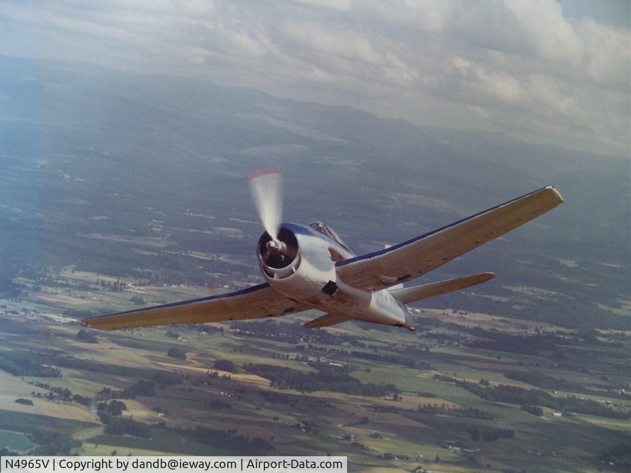 N4965V, Grumman F6F-3 Hellcat C/N 08825, Here is a early in flight photo, Not all markings have been applied.