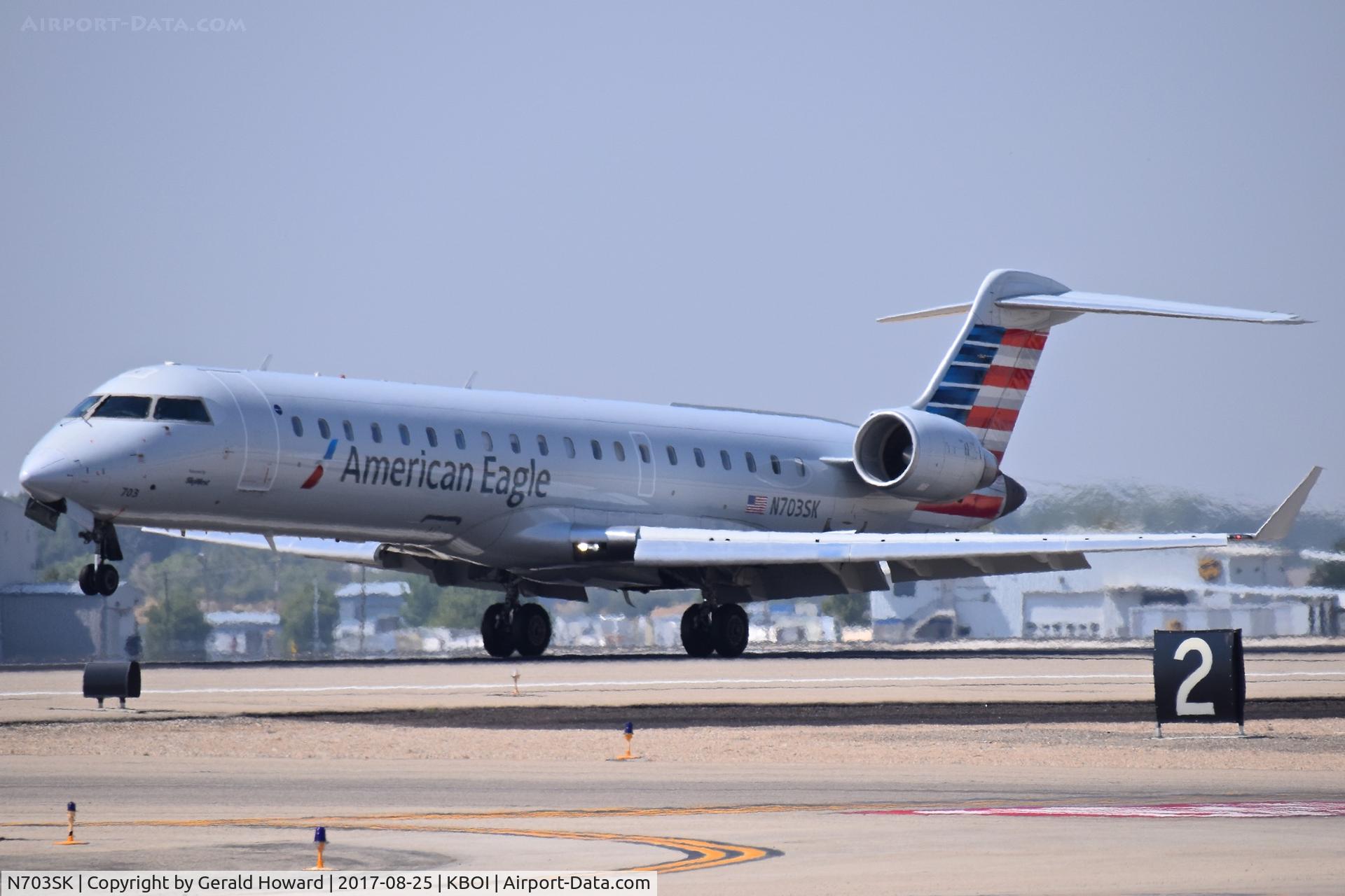N703SK, 2004 Bombardier CRJ-701ER (CL-600-2C10) Regional Jet C/N 10139, Landing RWY 10L.