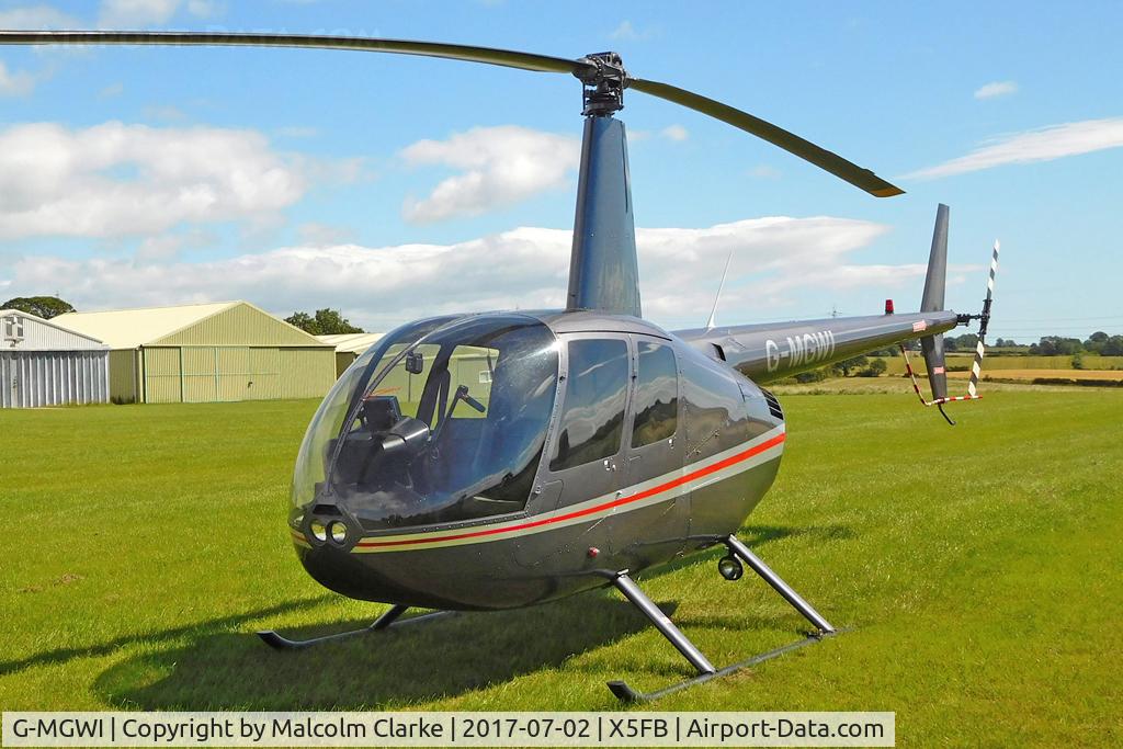G-MGWI, 2000 Robinson R44 Astro C/N 0663, Robinson R44 Astro at Fishburn Airfield, UK. July 21nd 2017.