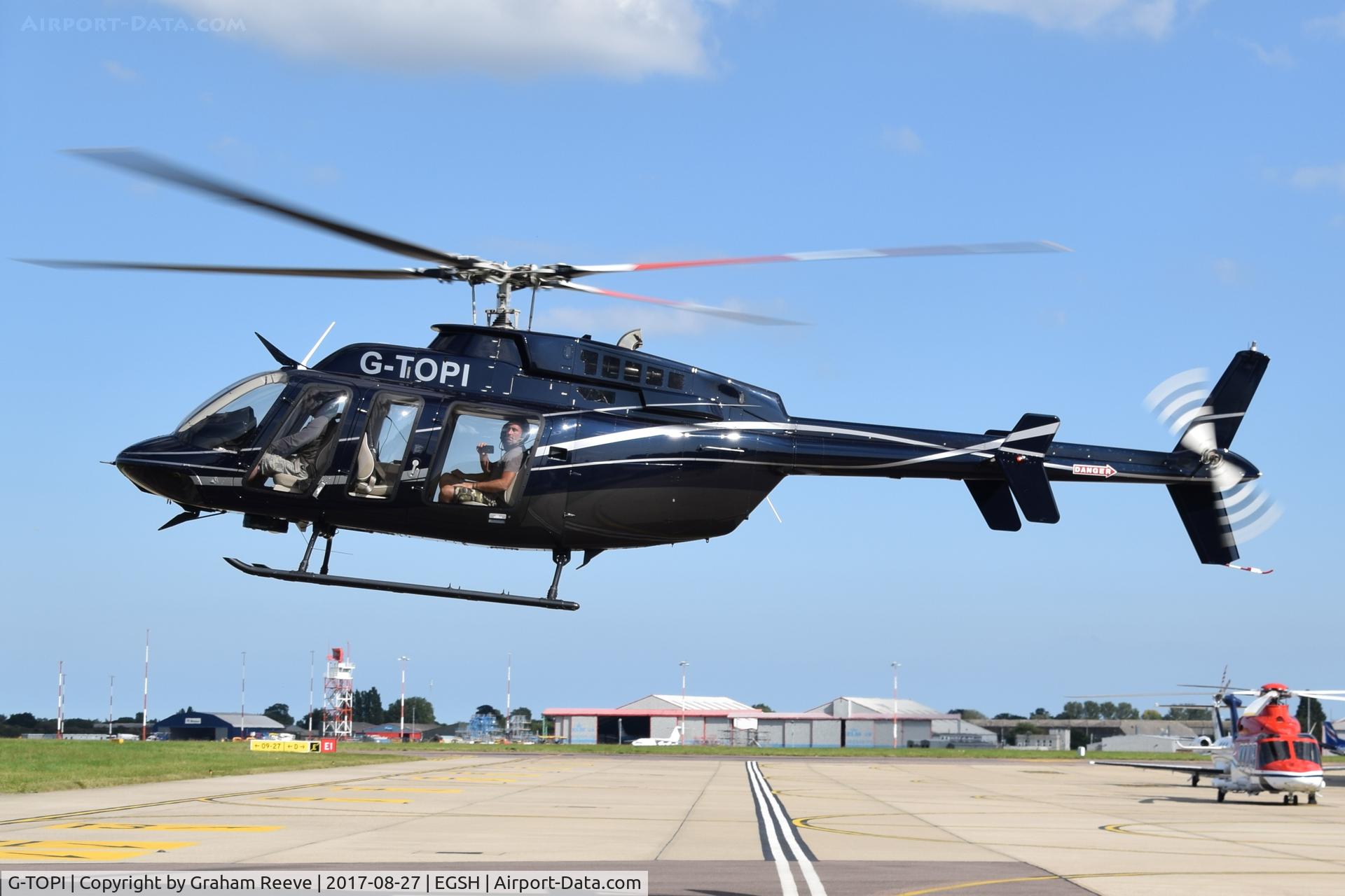 G-TOPI, 2015 Bell 407 C/N 54640, Departing from Norwich.