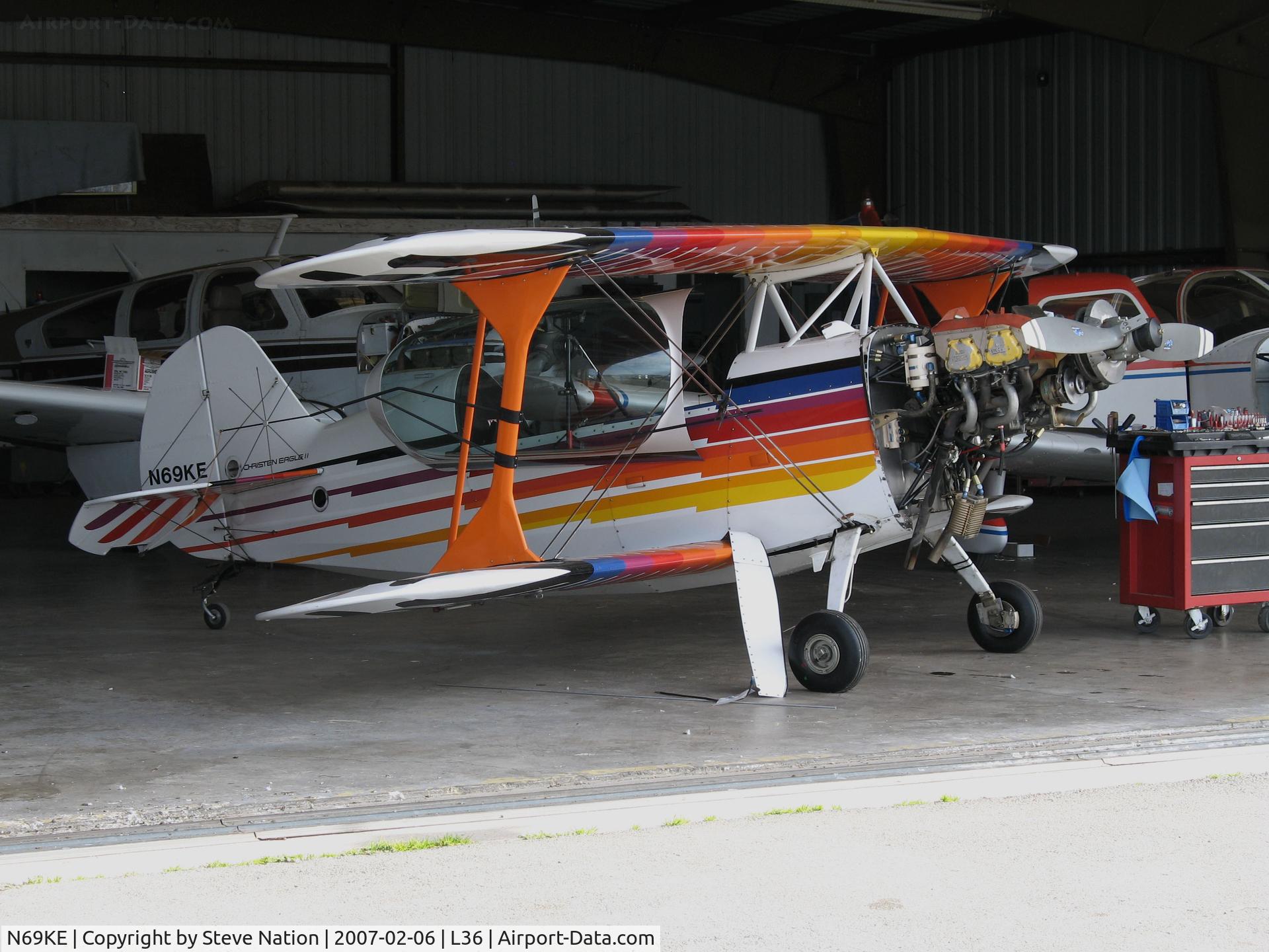 N69KE, Christen Eagle II C/N CANEVARI-0001, Locally-based 1981 Christian Eagle II with cowling panel missing in hangar entrance @ Rio Linda Airport, CA
