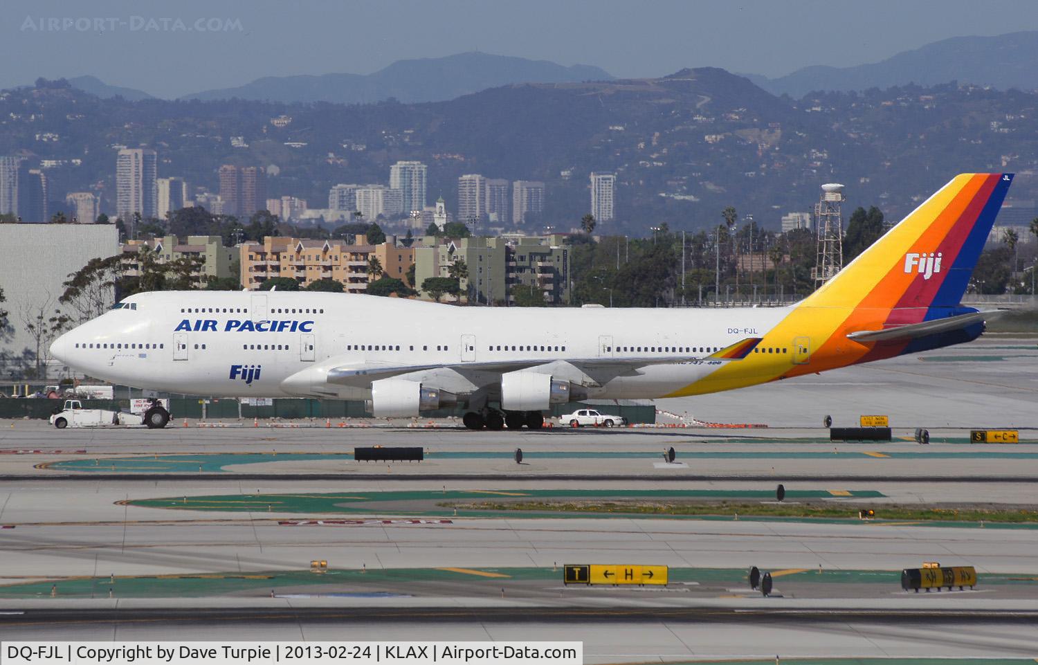 DQ-FJL, 1988 Boeing 747-412 C/N 24062, Being towed to a parking lot to free up a gate at LAX.