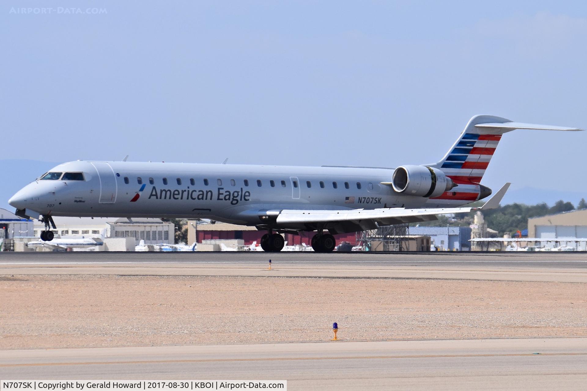 N707SK, 1999 Bombardier CRJ-701ER (CL-600-2C10) Regional Jet C/N 10003, Landing RWY 10L.