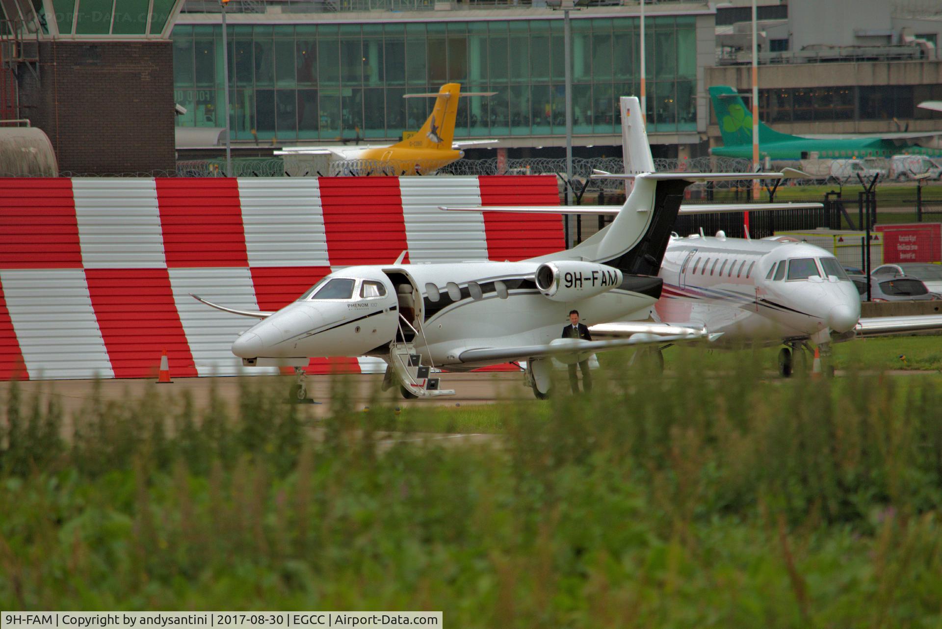 9H-FAM, 2009 Embraer EMB-500 Phenom 100 C/N 50000100, parked up on the [FBO] exc ramp @ egcc.