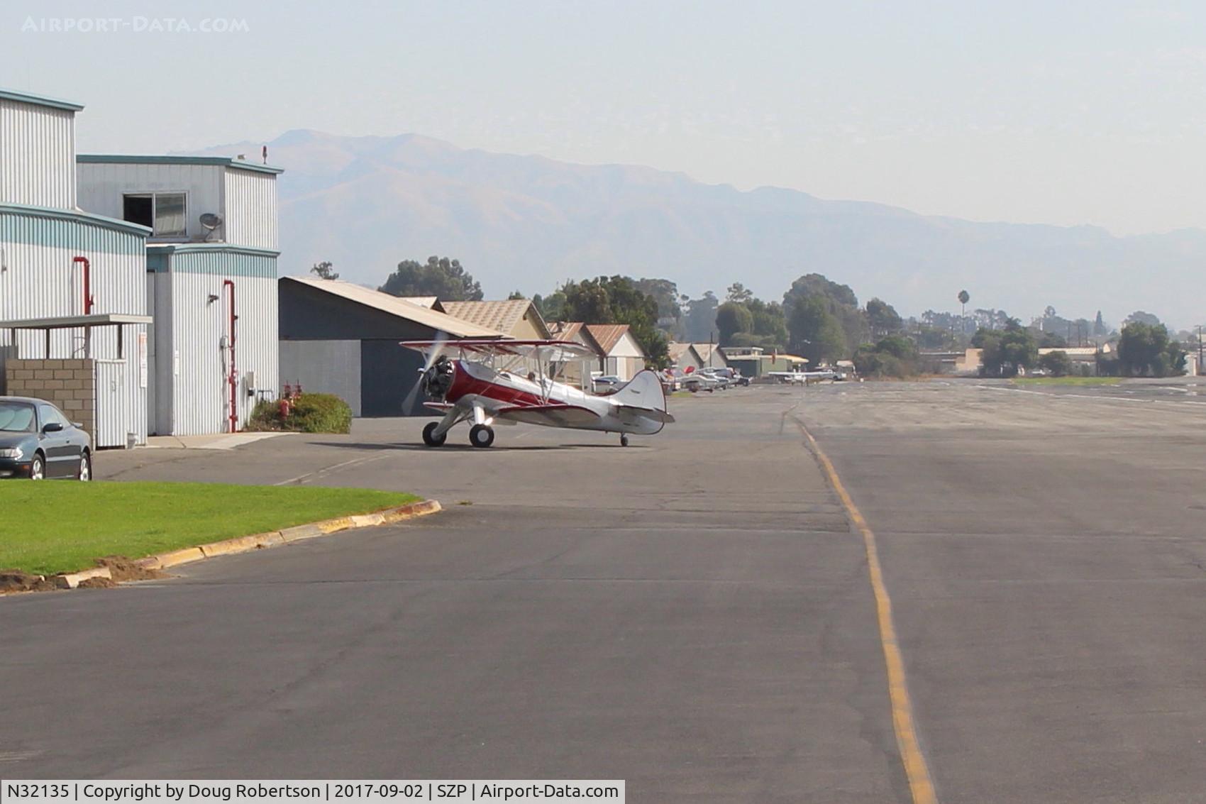 N32135, 1941 Waco UPF-7 C/N 5767, 1941 Waco UPF-7, Continental W670 220 Hp radial, a stunning show-plane with chromed prop and spinner, taxi to hangar after landing Rwy 22