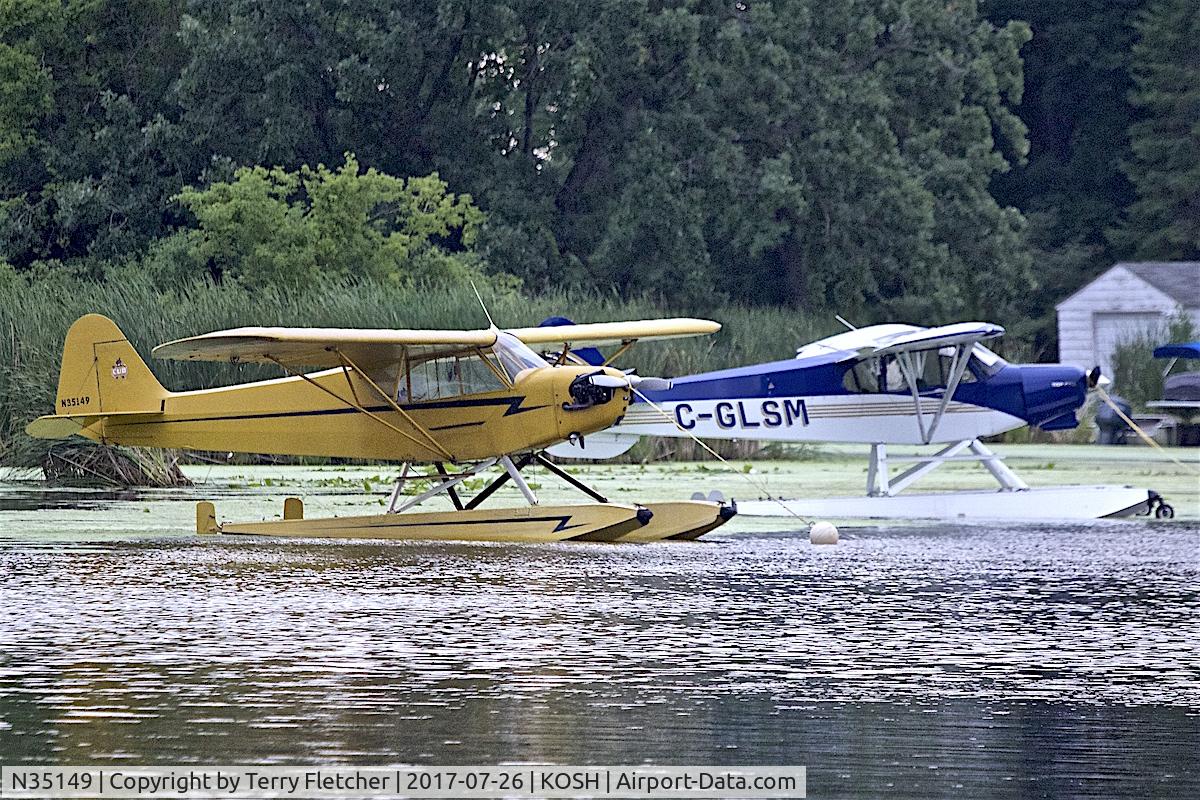 N35149, 1941 Piper J3C-65 Cub C/N 6174, at Lake Winnebago mooring during 2017 EAA AirVenture at Oshkosh