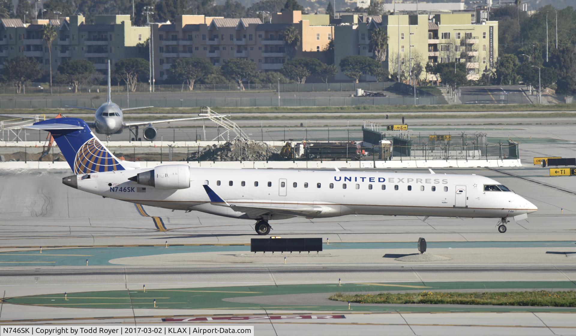 N746SK, 2005 Bombardier CRJ-700 (CL-600-2C10) Regional Jet C/N 10202, Taxiing to gate at LAX