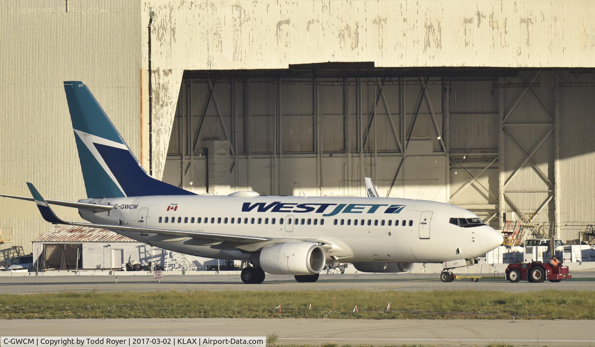 C-GWCM, 2003 Boeing 737-7CT C/N 32756, Getting towed to gate at LAX