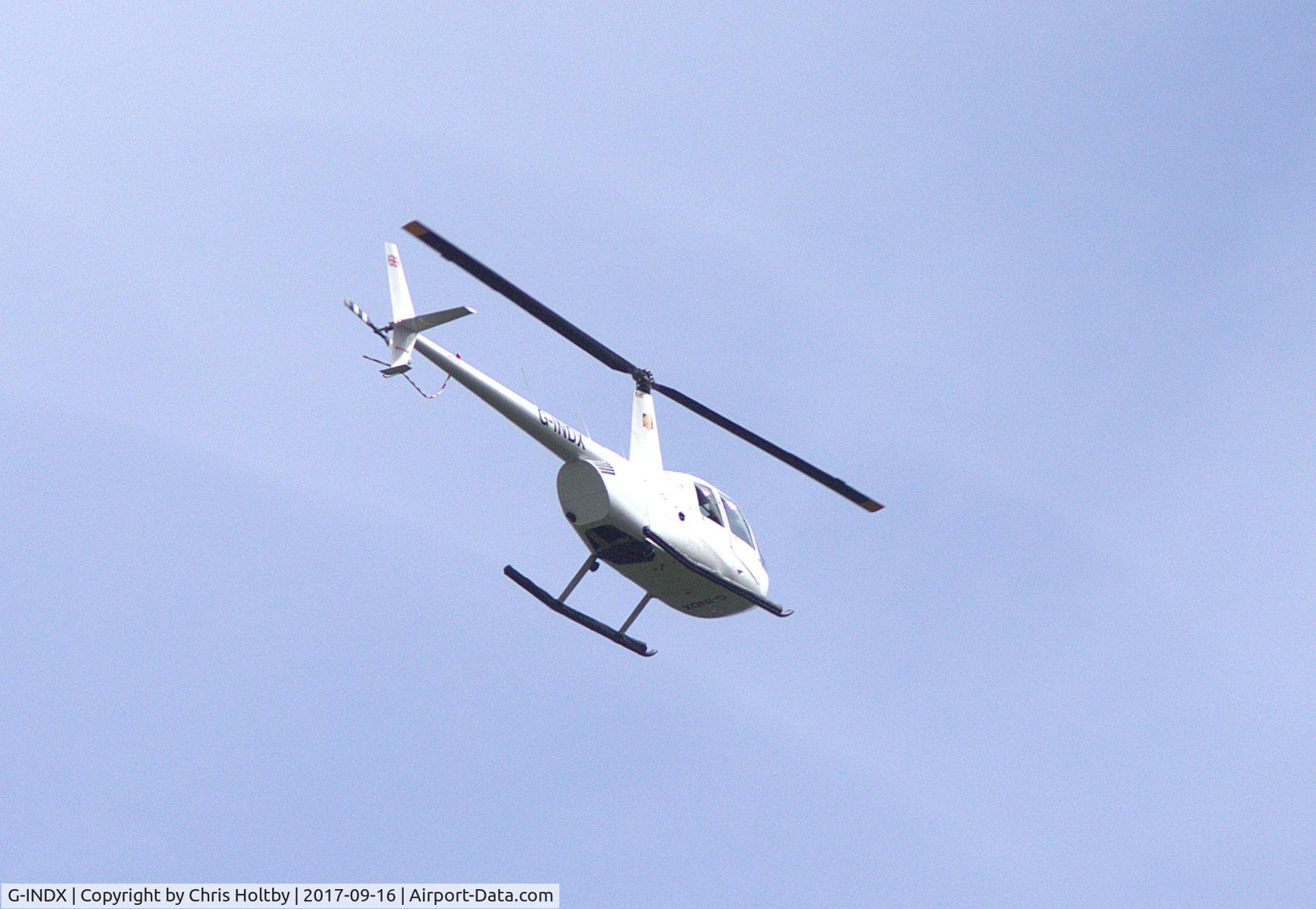 G-INDX, 2004 Robinson R44 Clipper II C/N 10491, Over Potters Bar, Herts showing new livery