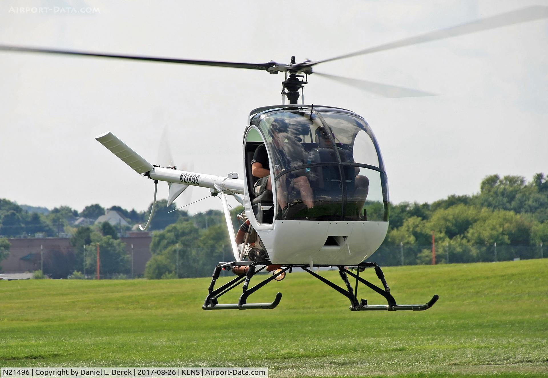N21496, Schweizer 269C-1 C/N 0358, Another lucky sightseer takes off for a flight over the Amish countryside.