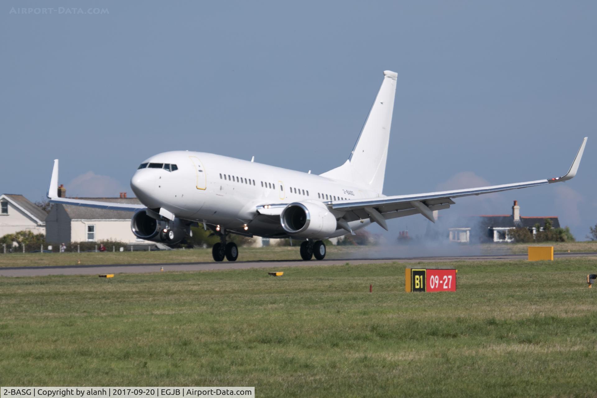 2-BASG, 2011 Boeing 737-73W C/N 40117, Touching down in Guernsey after a delivery flight from Basel - newly placed on the 2- (Guernsey) register