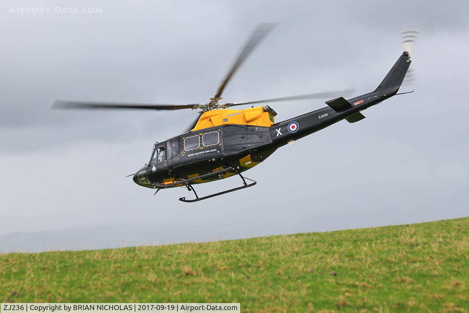 ZJ236, 1994 Bell 412EP Griffin HT1 C/N 36145, Mid Wales training flight, on a peak 900ft usl, in the rain and wind, o what fun. One of the last flights this year by a Griffin.