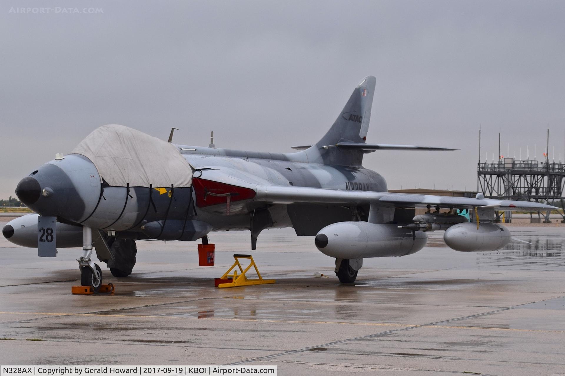 N328AX, 1958 Hawker Hunter Mk.58 C/N 41H-697398, One of 3 ATAC aircraft parked on the south GA ramp.