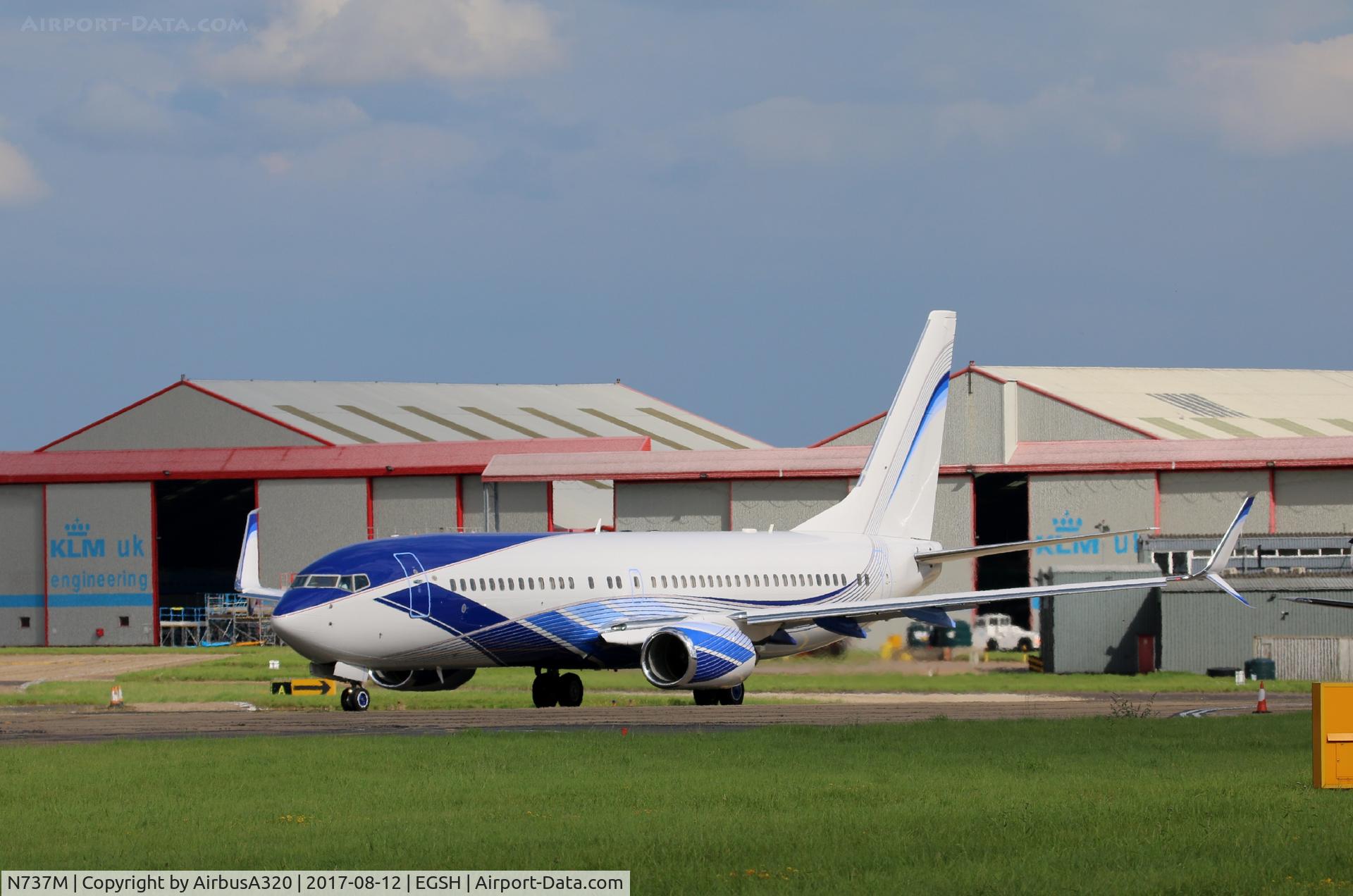 N737M, 2002 Boeing 737-8EQ BBJ C/N 33361, rolled out freshly painted in the new livery
