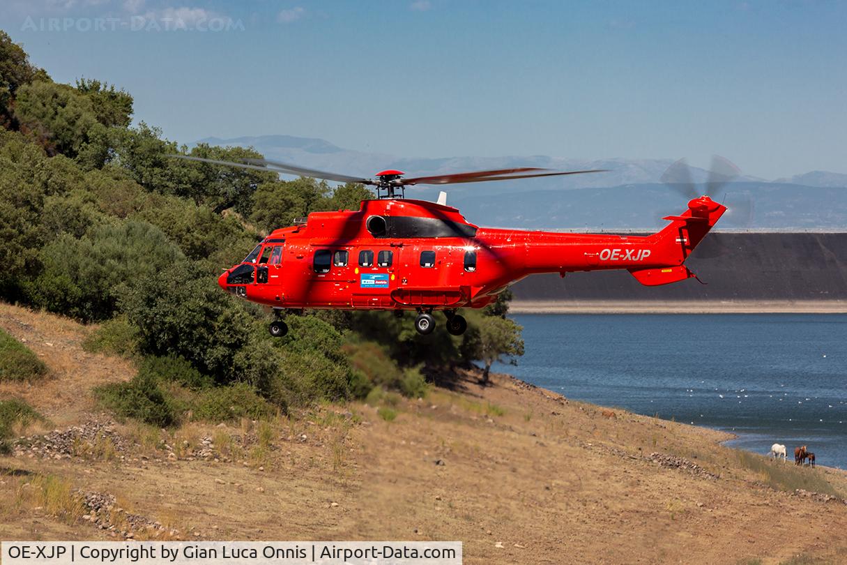 OE-XJP, 1983 Aerospatiale AS-332L Super Puma C/N 2102, LANDING OVER RIVER