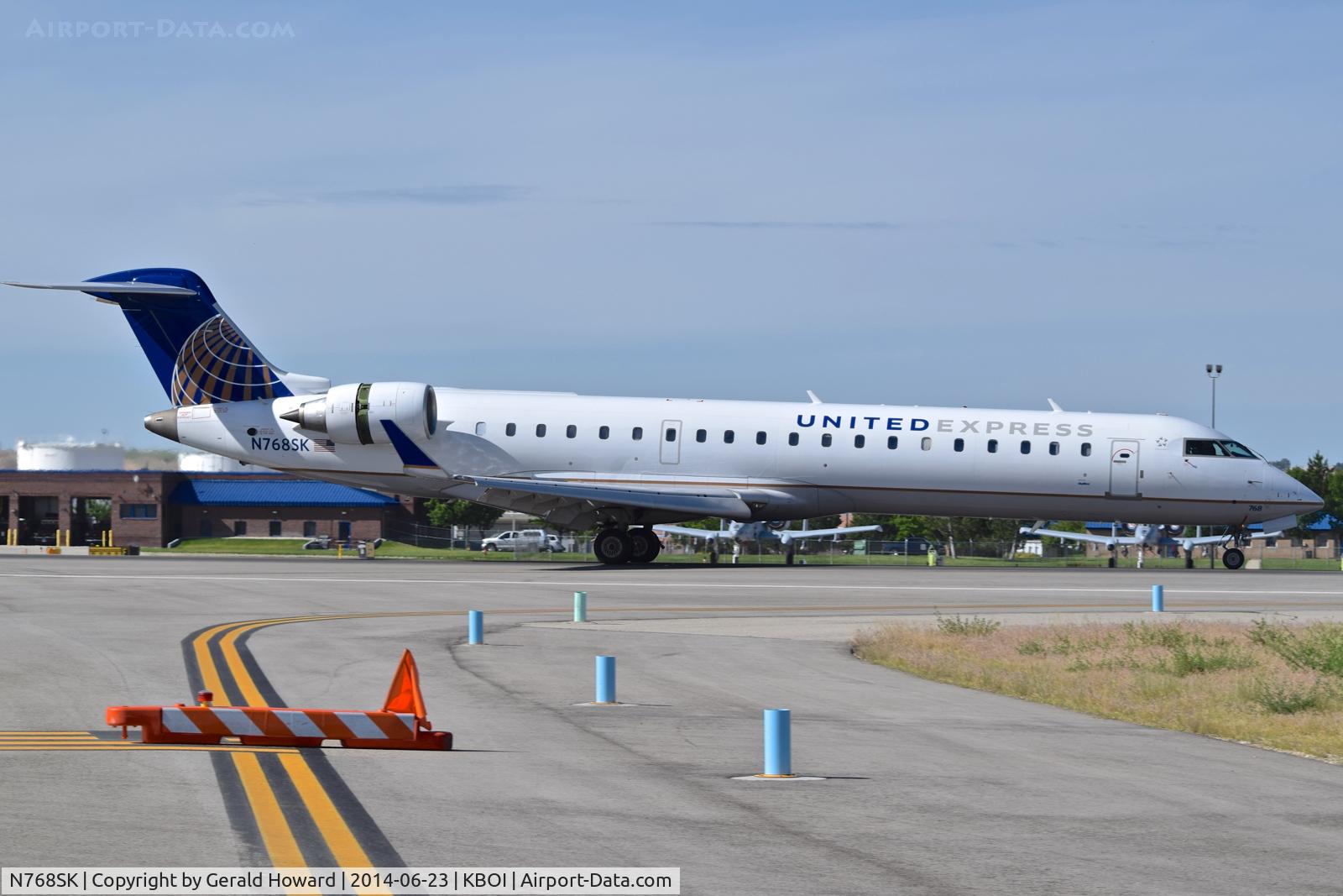 N768SK, 2005 Bombardier CRJ-701ER (CL-600-2C10) Regional Jet C/N 10234, Landing roll out on RWY 28L.