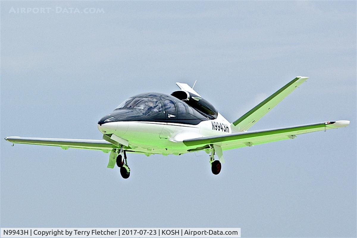 N9943H, 2016 Cirrus SF50 Vision C/N 0007, Green reflects from the landing marks as this Cirrus SF50 Vision prepares to land at Oshkosh