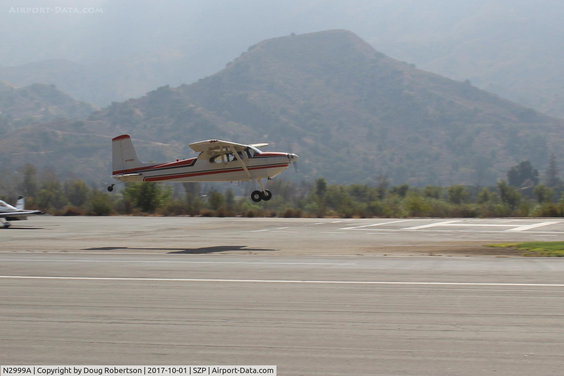 N2999A, 1953 Cessna 180 C/N 30199, 1953 Cessna 180, Continental O-470-A 225 Hp, on final for Rwy 22L grass