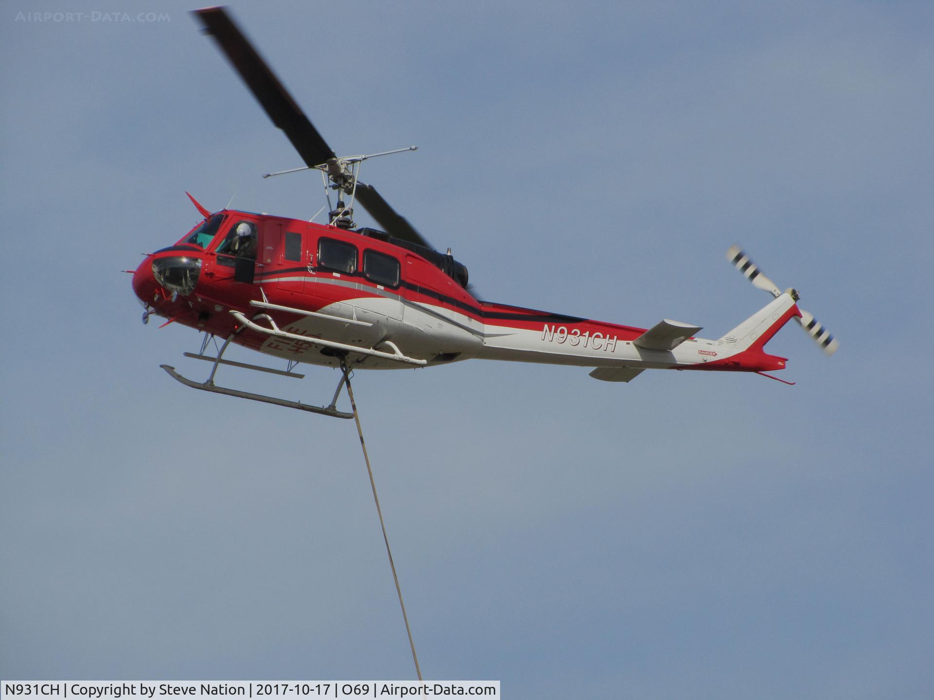 N931CH, 1972 Bell 205A-1 C/N 30110, Pilot of Heligroup Fire LLC (Missoula, MT) 1972 Bell 205A-1 watching the Bambi bucket on return to Petaluma Municipal Airport, CA temporary home base from making water drops on the devastating October 2017 Northern California wildfires