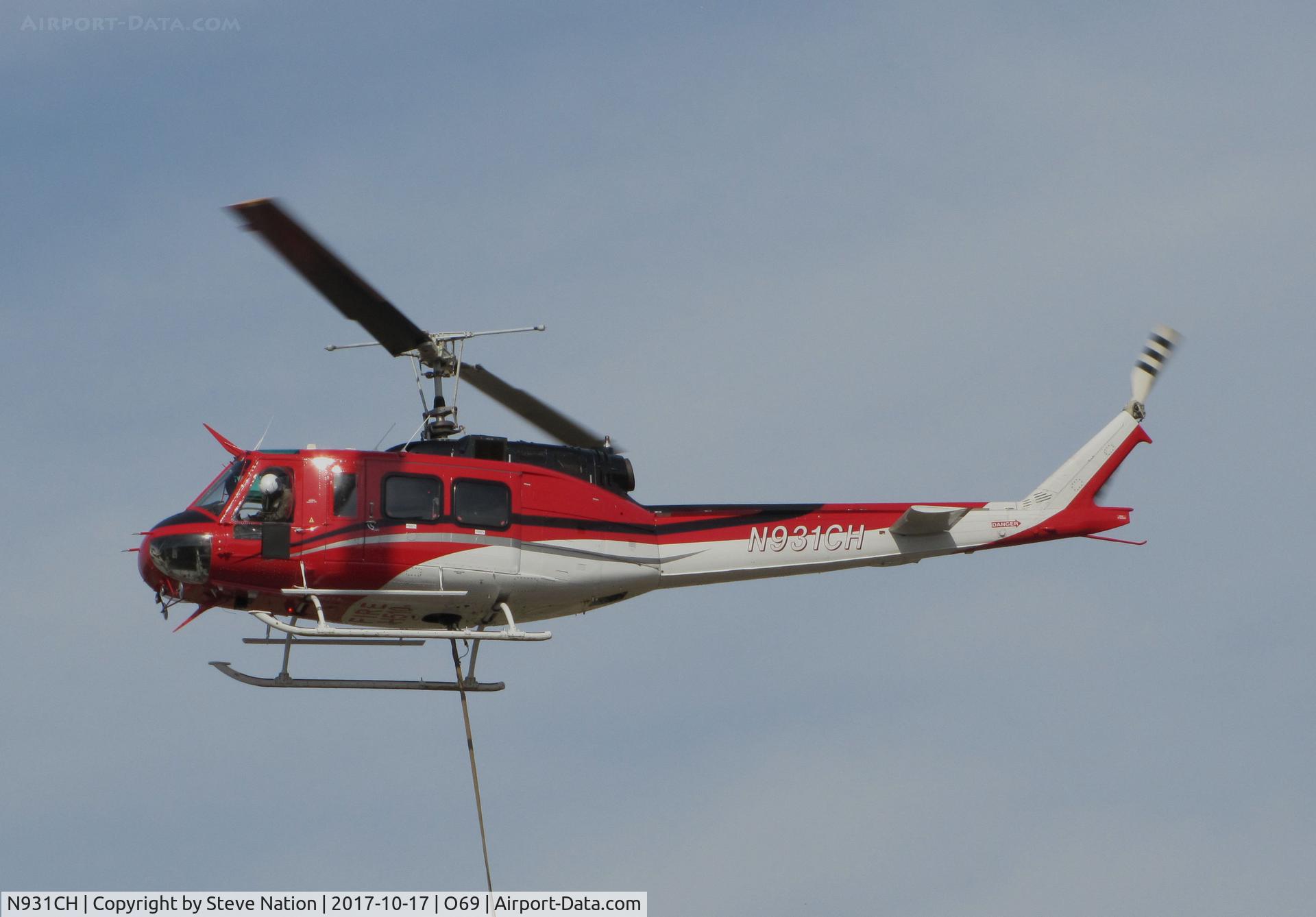 N931CH, 1972 Bell 205A-1 C/N 30110, Pilot of Heligroup Fire LLC (Missoula, MT) 1972 Bell 205A-1 watching the Bambi bucket on return to Petaluma Municipal Airport, CA temporary home base after water drops on the devastating October 2017 Northern California wildfires (note FIRE H510 on belly)
