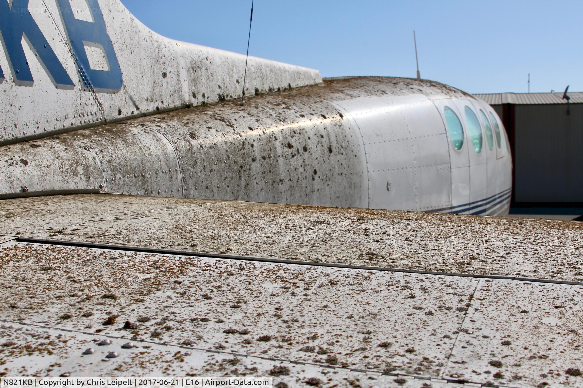 N821KB, 1966 Cessna 411 C/N 411-0201, Locally-based 1966 Cessna 411 parked and rotting on the ramp at San Martin Airport, CA.