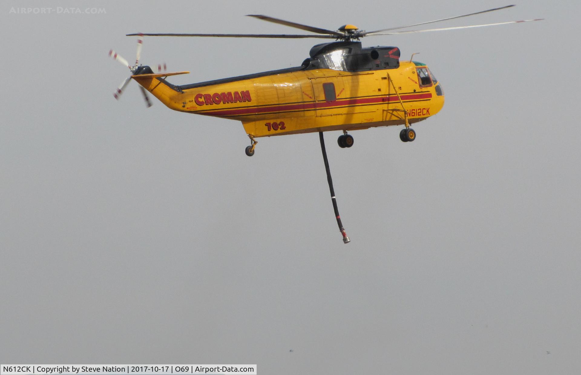 N612CK, 1962 Sikorsky SH-3H Sea King (S-61) C/N 149713, Croman Corp (White City, OR) 1962 Sikorsky SH-3H Sea King hovering for landing at Petaluma Municipal Airport, CA temporary home base after making water drops on the devastating October 2017 Northern California wild fires
