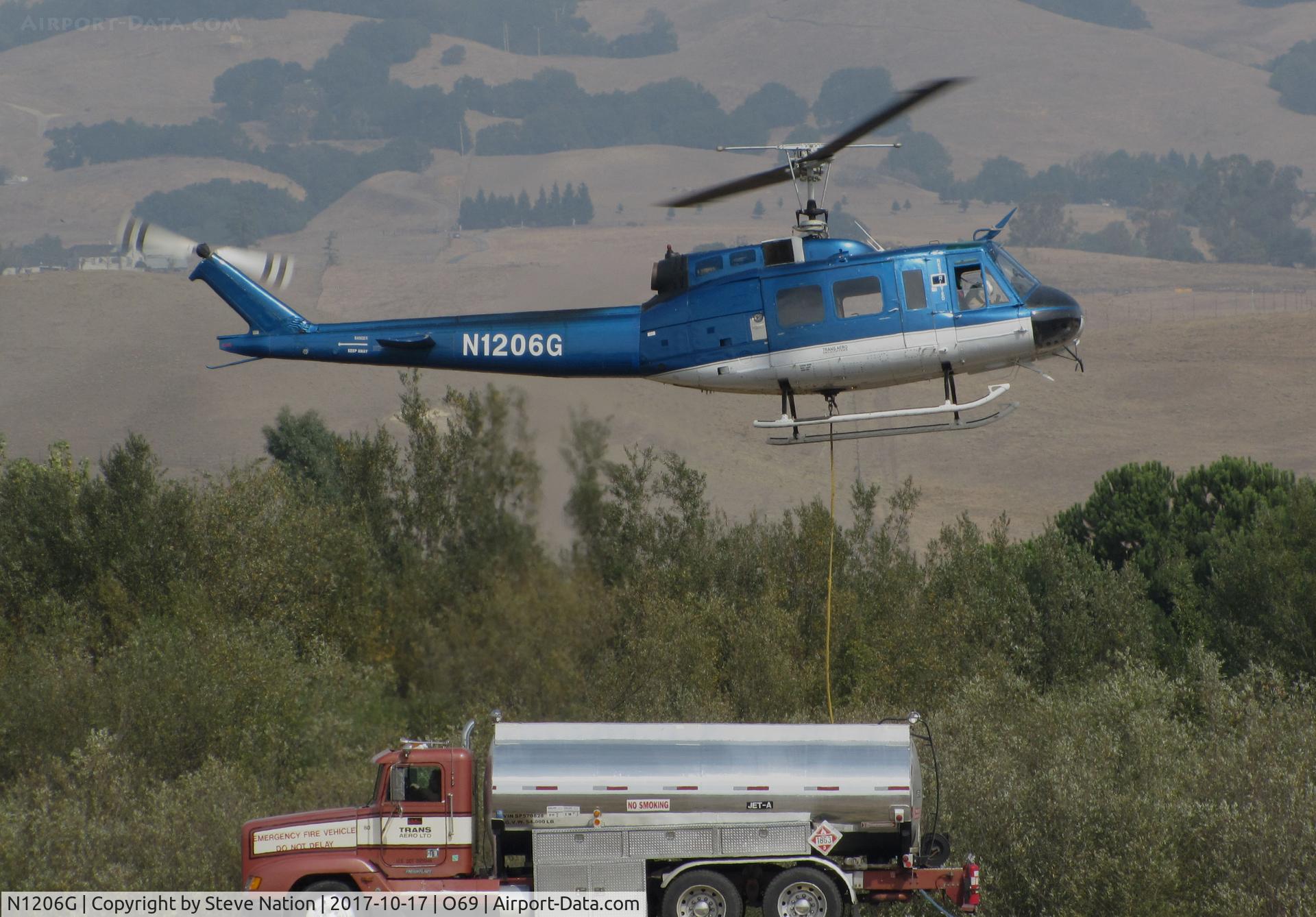 N1206G, 1966 Bell UH-1H Iroquois C/N 5269 (66-0786), Trans Aero (Cheyenne, WY) 1966 Bell UH-1H preparing to land at Petaluma Municipal Airport, CA temporary home base after making water drops on the devastating October 2017 Northern California wildfires