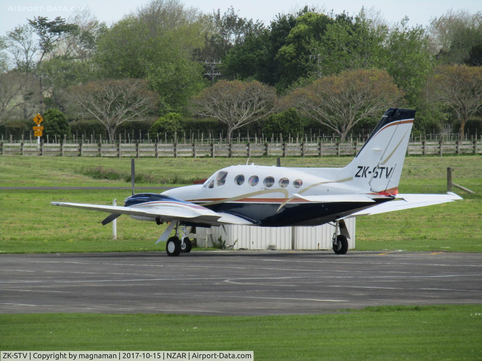 ZK-STV, 1978 Cessna 421C Golden Eagle C/N 421C0455, across grass and apron view