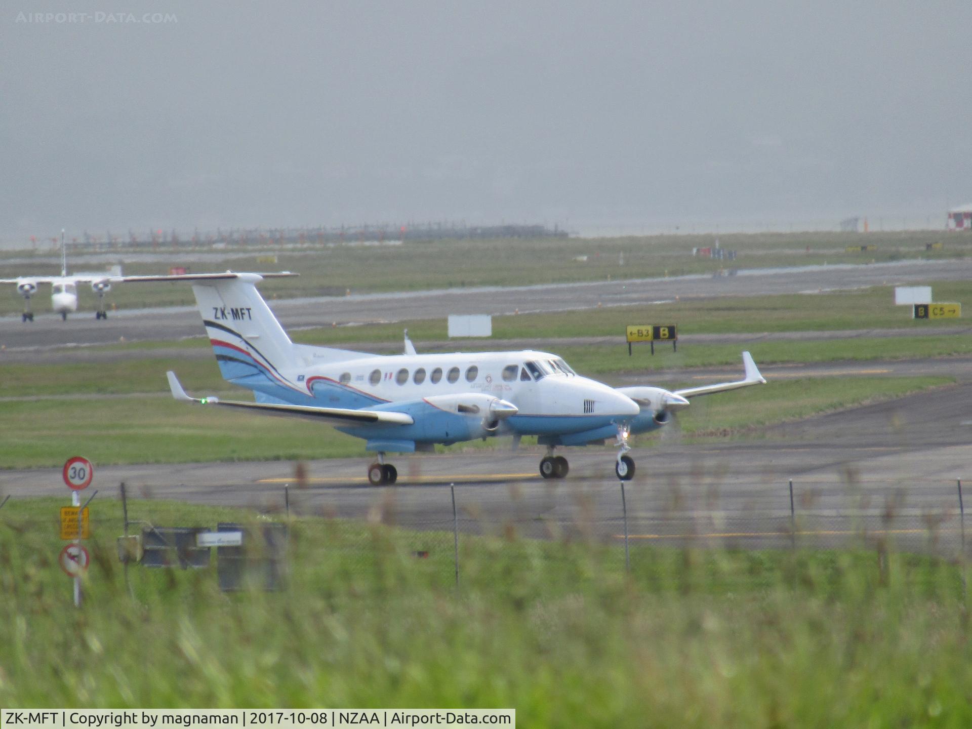 ZK-MFT, 1988 Beechcraft B200 King Air C/N BB-1298, long range shot from car park