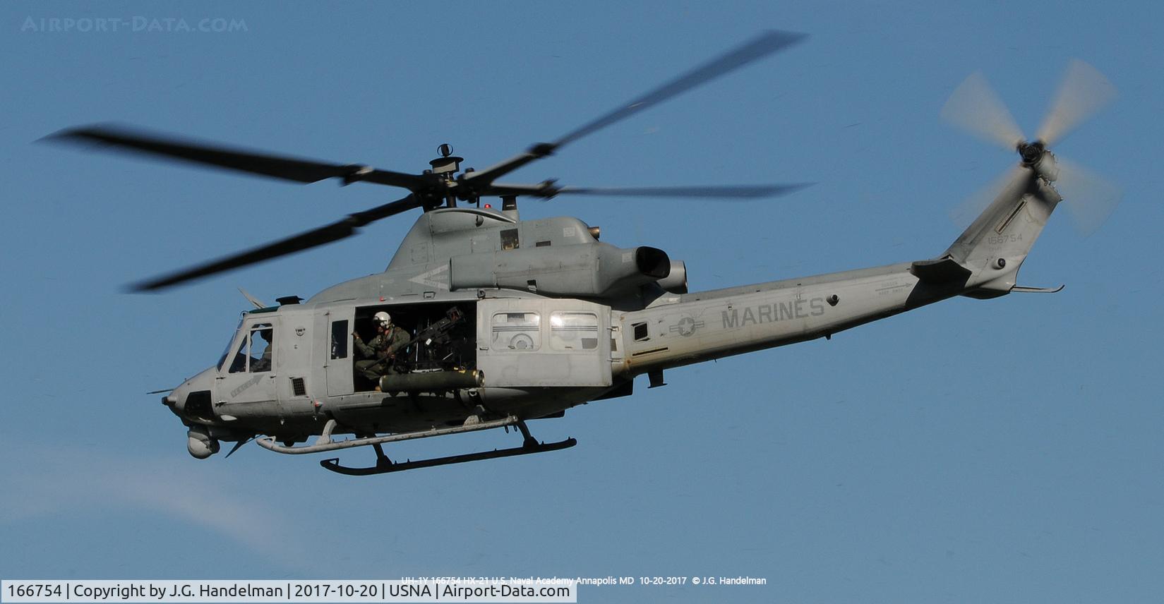 166754, Bell UH-1Y Venom C/N 55004/Y4, Lift off at U.S. Naval Academy.  Note .50 cal M-2 in port door opening.