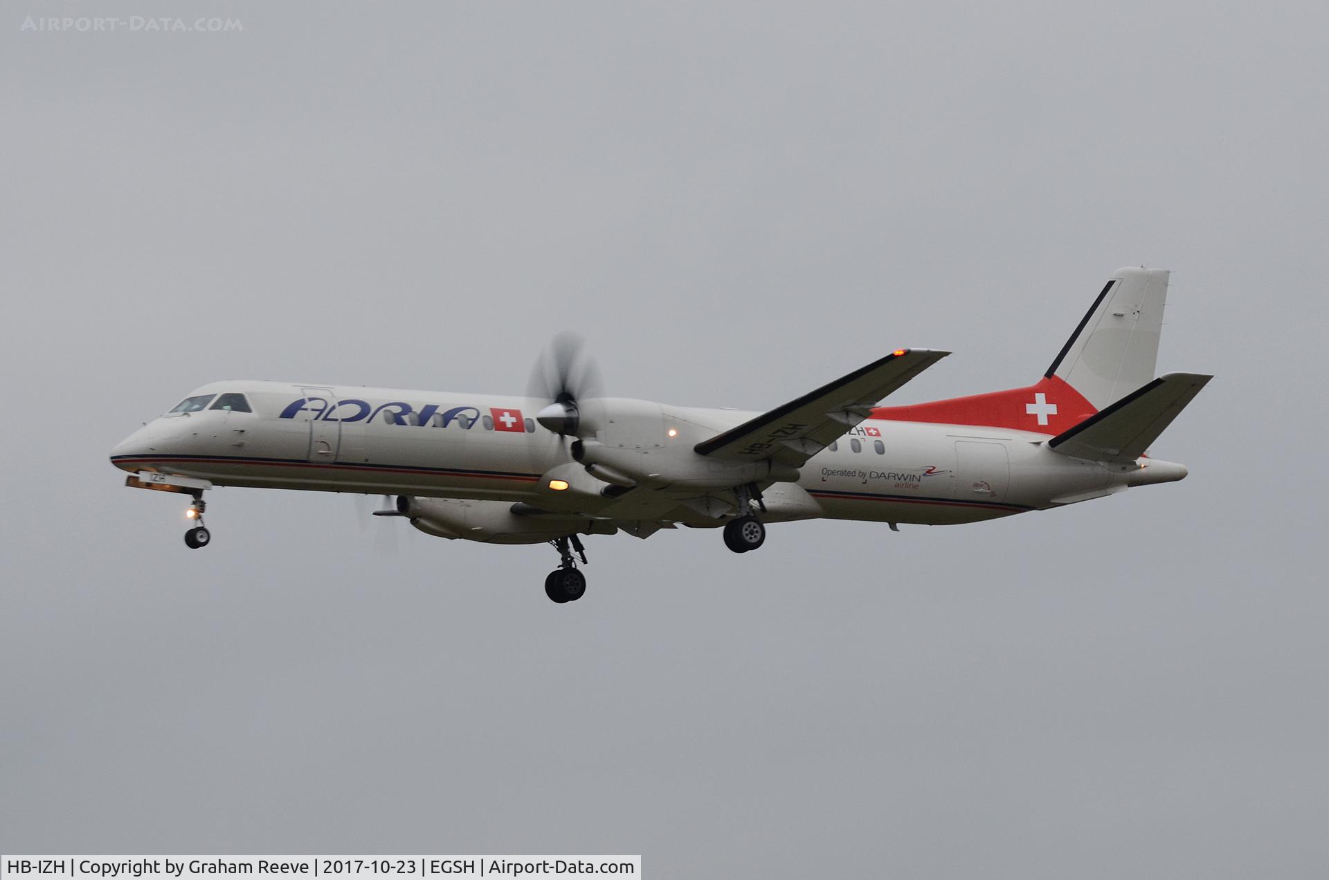 HB-IZH, 1994 Saab 2000 C/N 2000-011, Landing at Norwich.