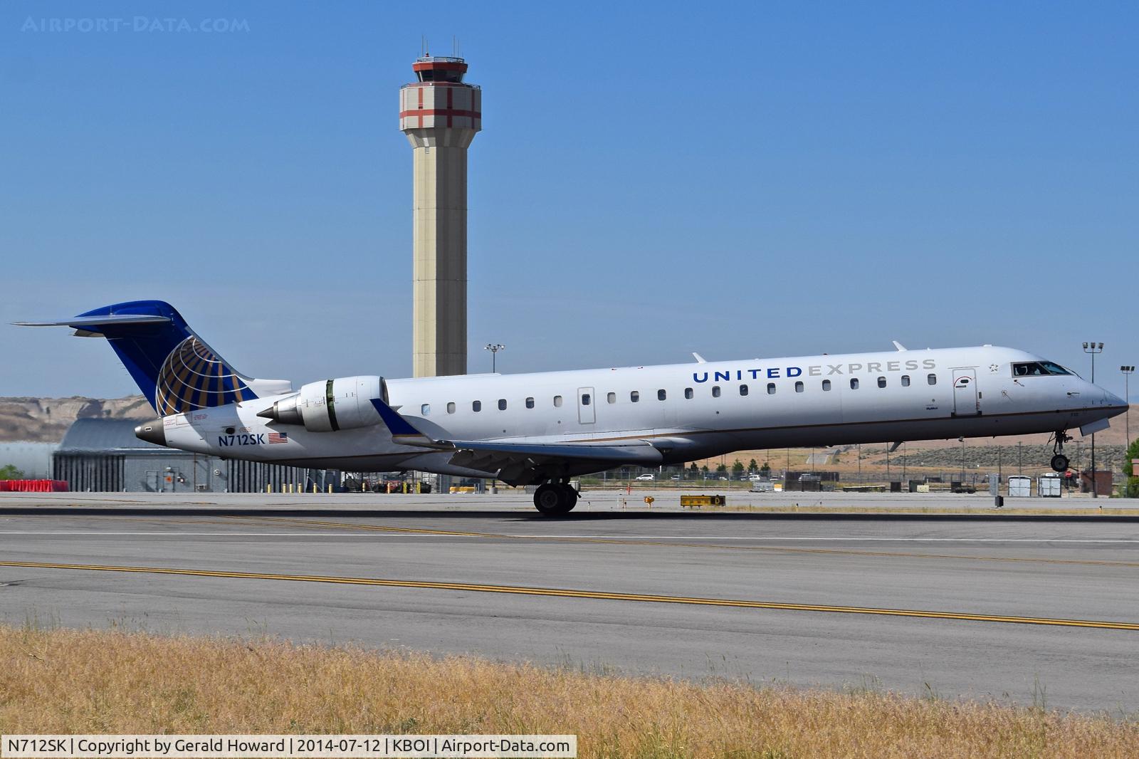 N712SK, 2004 Bombardier CRJ-700 (CL-600-2C10) Regional Jet C/N 10172, Landing roll out on RWY 28L.