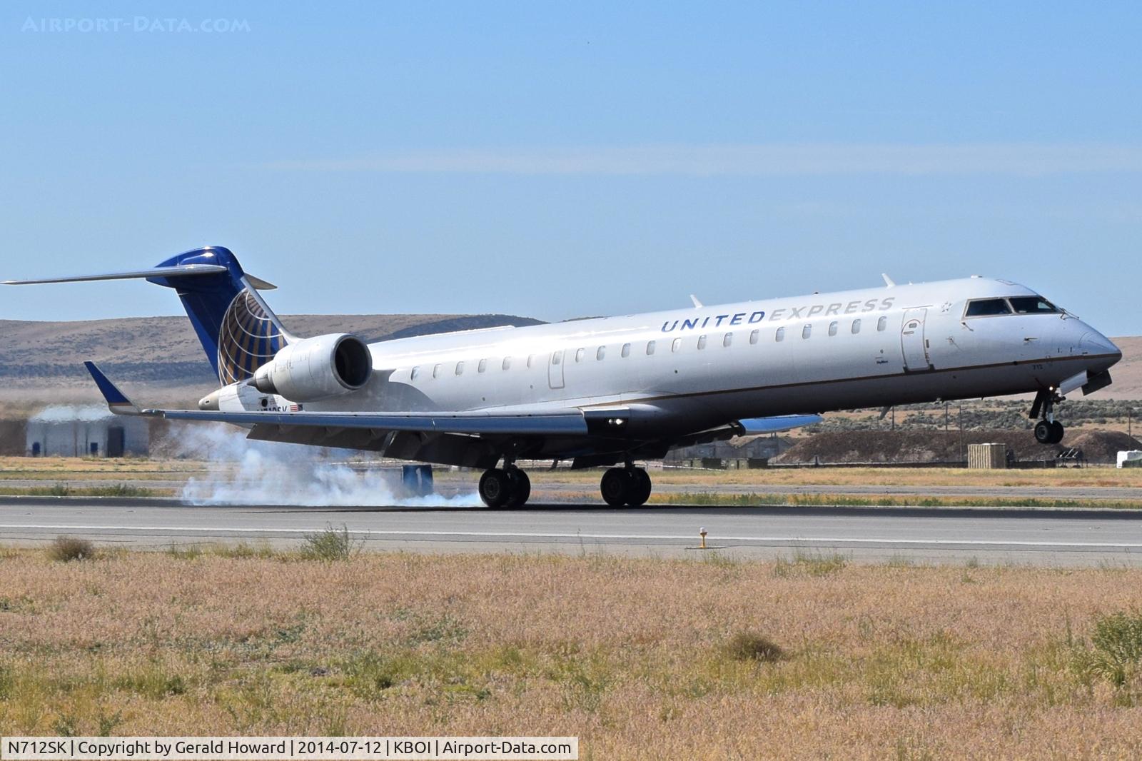 N712SK, 2004 Bombardier CRJ-700 (CL-600-2C10) Regional Jet C/N 10172, Touch down on RWY 28L.
