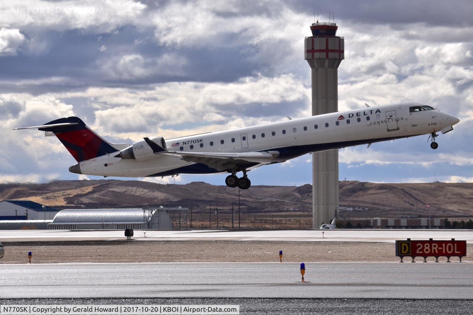 N770SK, 2006 Canadair CL-600-2C10 Regional Jet CRJ-700 C/N 10243, Take off climb from RWY 28R.