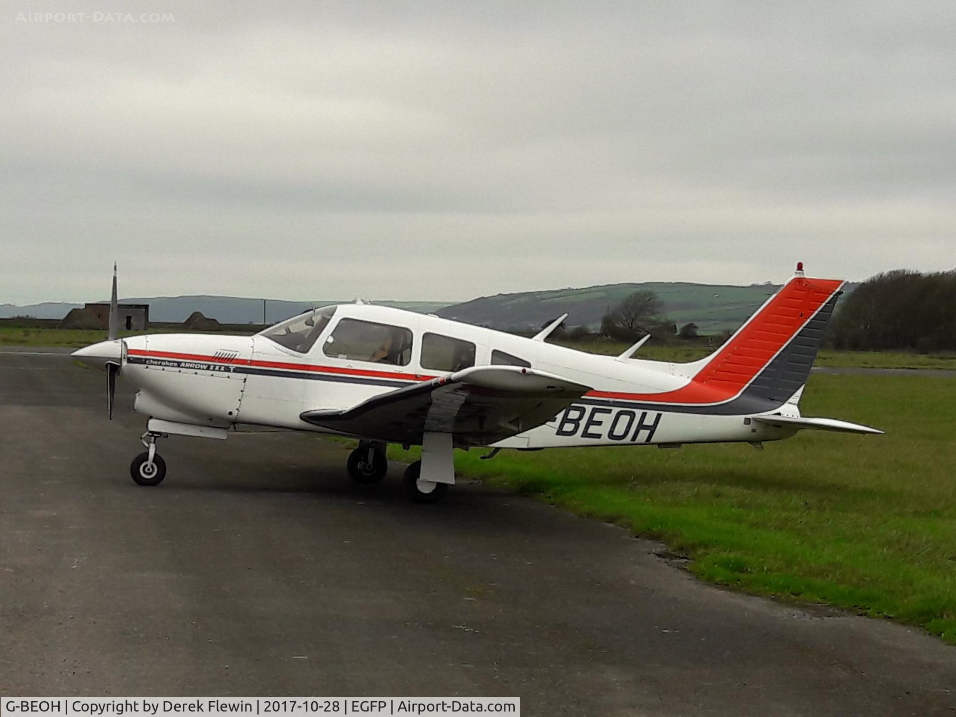 G-BEOH, 1977 Piper PA-28R-201T Cherokee Arrow III C/N 28R-7703038, Turbo Cherokee Arrow III, Gloucestershire Flying Club, seen parked up.