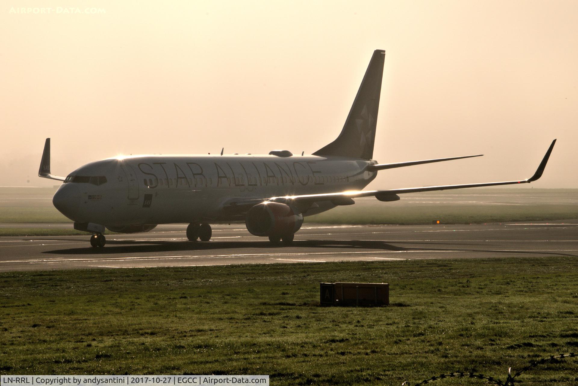 LN-RRL, 2003 Boeing 737-883 C/N 28328, taxing in fog in the back ground.
