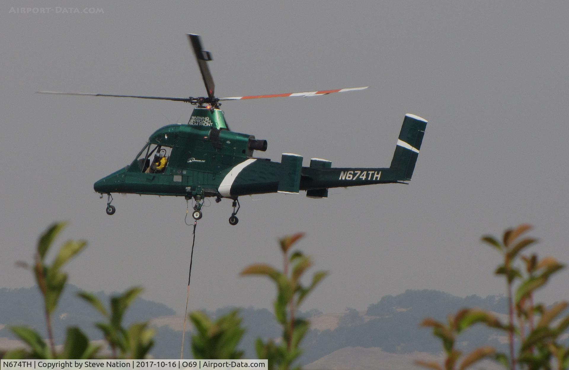 N674TH, 2004 Kaman K-1200 K-Max C/N A94-0035, Timberline Helicopters (Sand Point, ID) 2004 Kaman K-1200 K-MAX water dropping helicopter landing @ Petaluma Municipal Airport, CA temporary home base in support of efforts to control devastating Northern California Oct 2017 wildfires