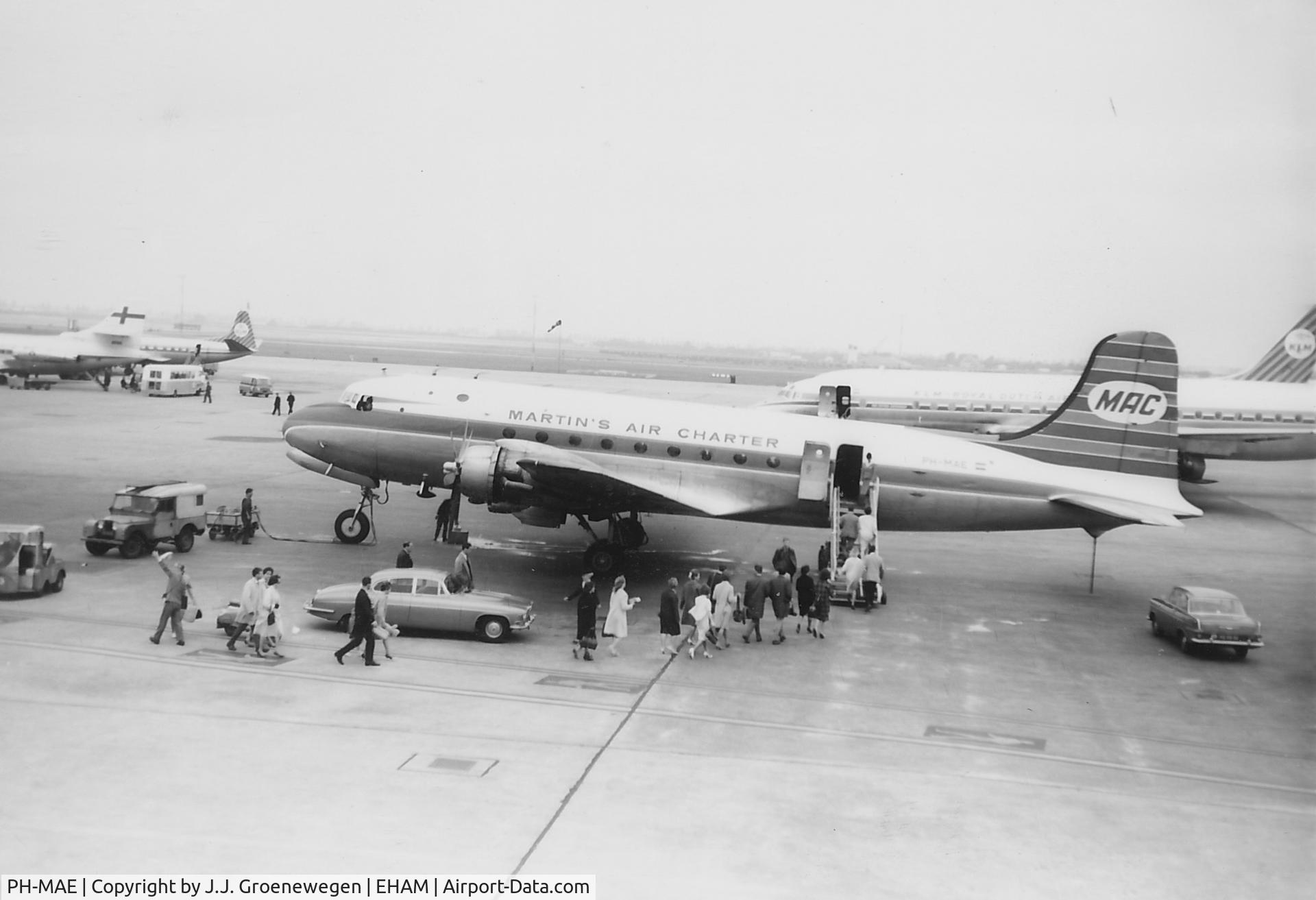 PH-MAE, 1942 Douglas C-54B Skymaster C/N 10538, Passenger boarding PH-MAE at Schiphol (Amsterdam).
Ca. 1964