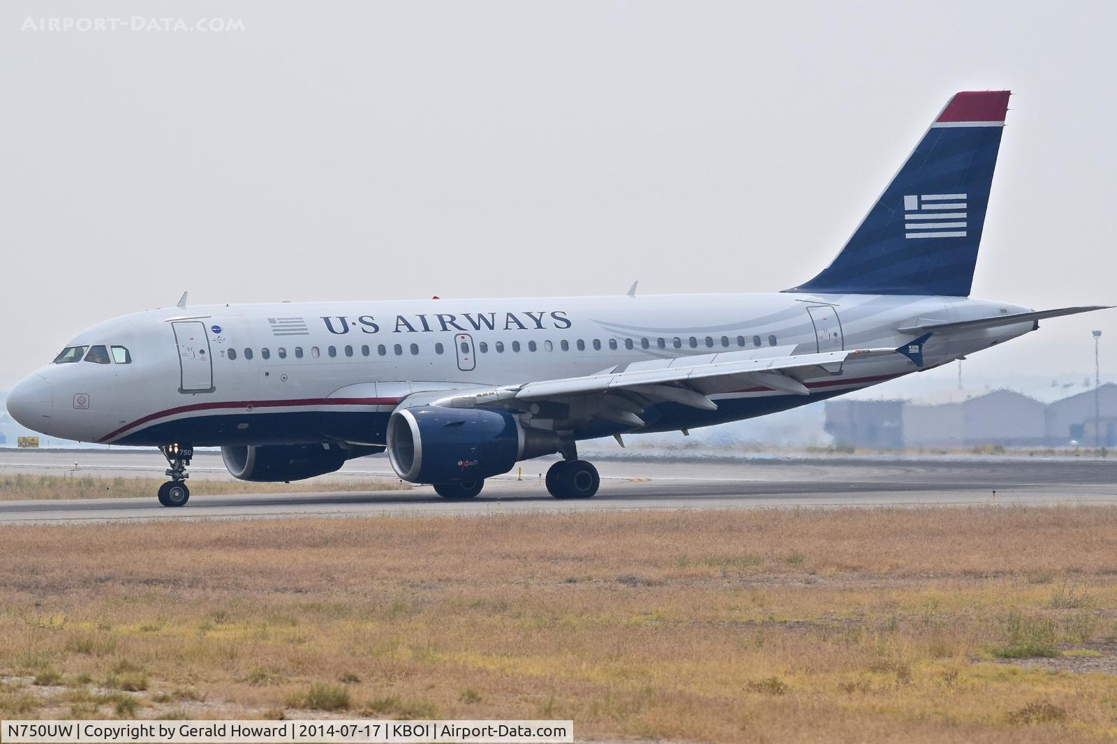 N750UW, 2000 Airbus A319-112 C/N 1315, Turning onto Golf from RWY 10R.