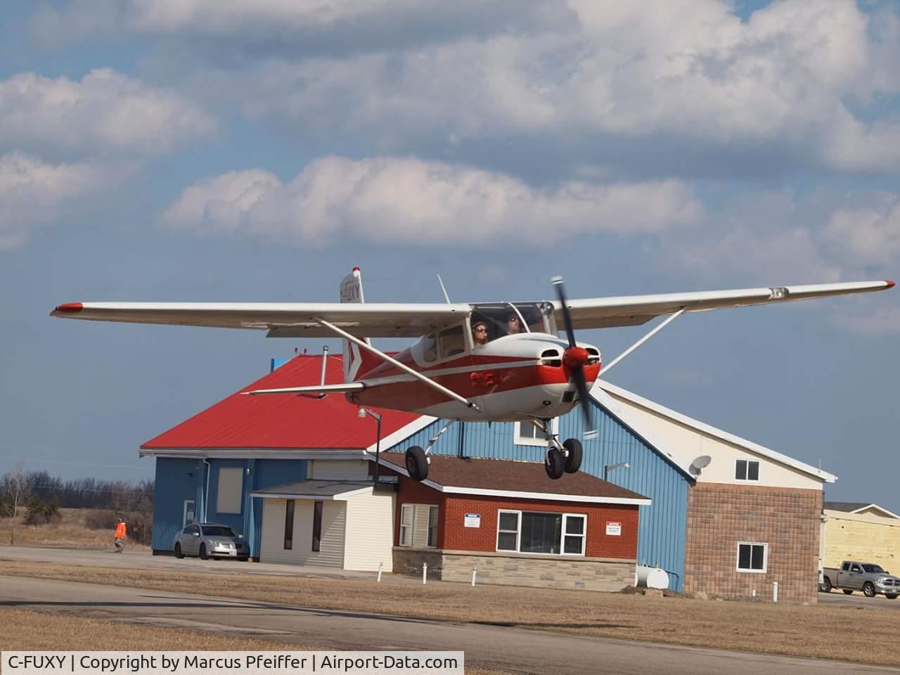 C-FUXY, 1958 Cessna 172 C/N 36517, Low and Over holding center in a stiff crosswind at Stoney Creek
