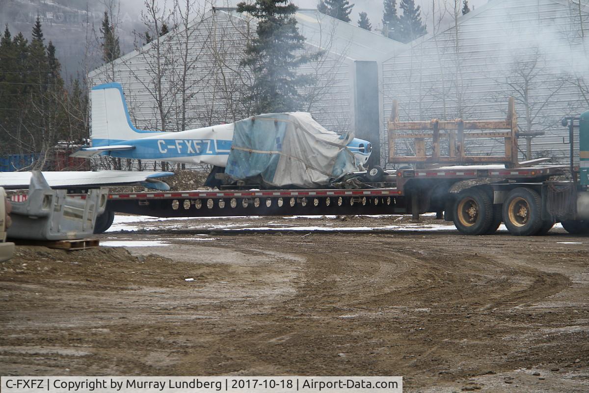 C-FXFZ, 1957 Cessna 172 C/N 36129, The wreckage of C-FXFZ being removed from behind the gas station at Macrae, along the Alaska Highway in Whitehorse, Yukon.
