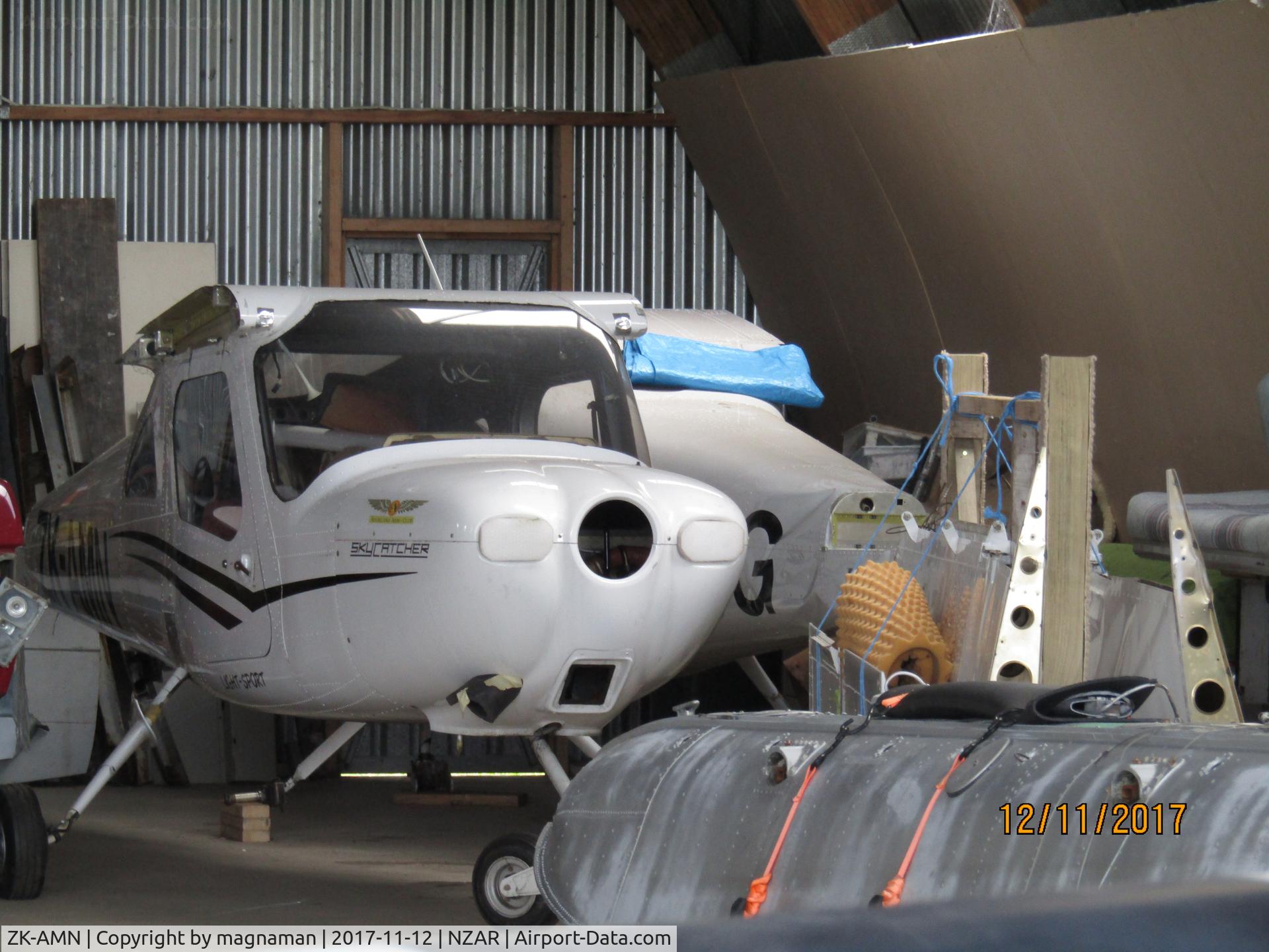 ZK-AMN, Cessna 162 Skycatcher C/N 16200121, along with ZK-VCG in back of hangar after storm damage a few years back.