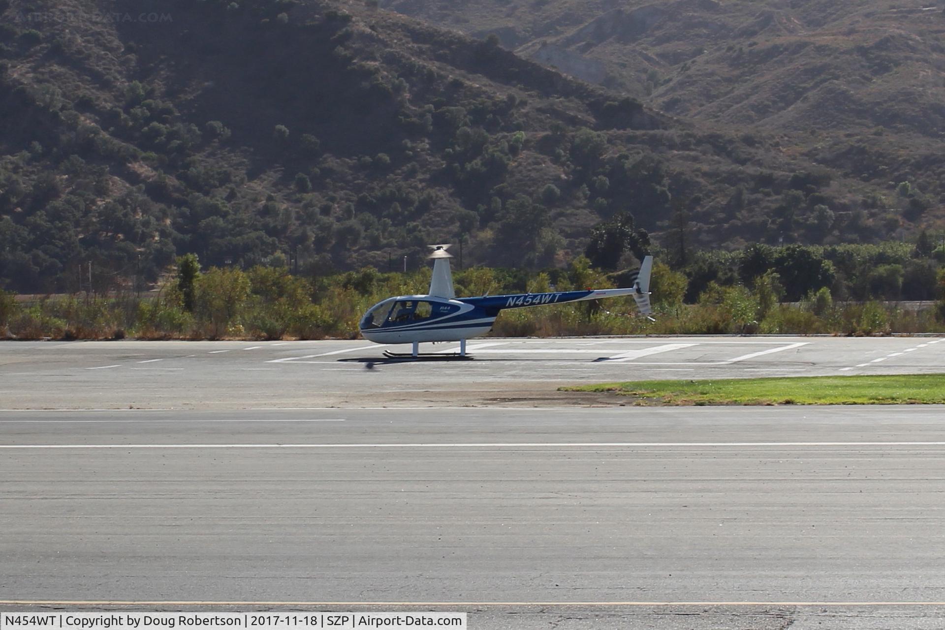 N454WT, 2001 Robinson R44 Raven II C/N 1042, 2001 Robinson R44 RAVEN, Lycoming O-540-F1B5 derated to 205 Hp continuous, engine warmup-turning and burning-for departure-on SZP Helipad
