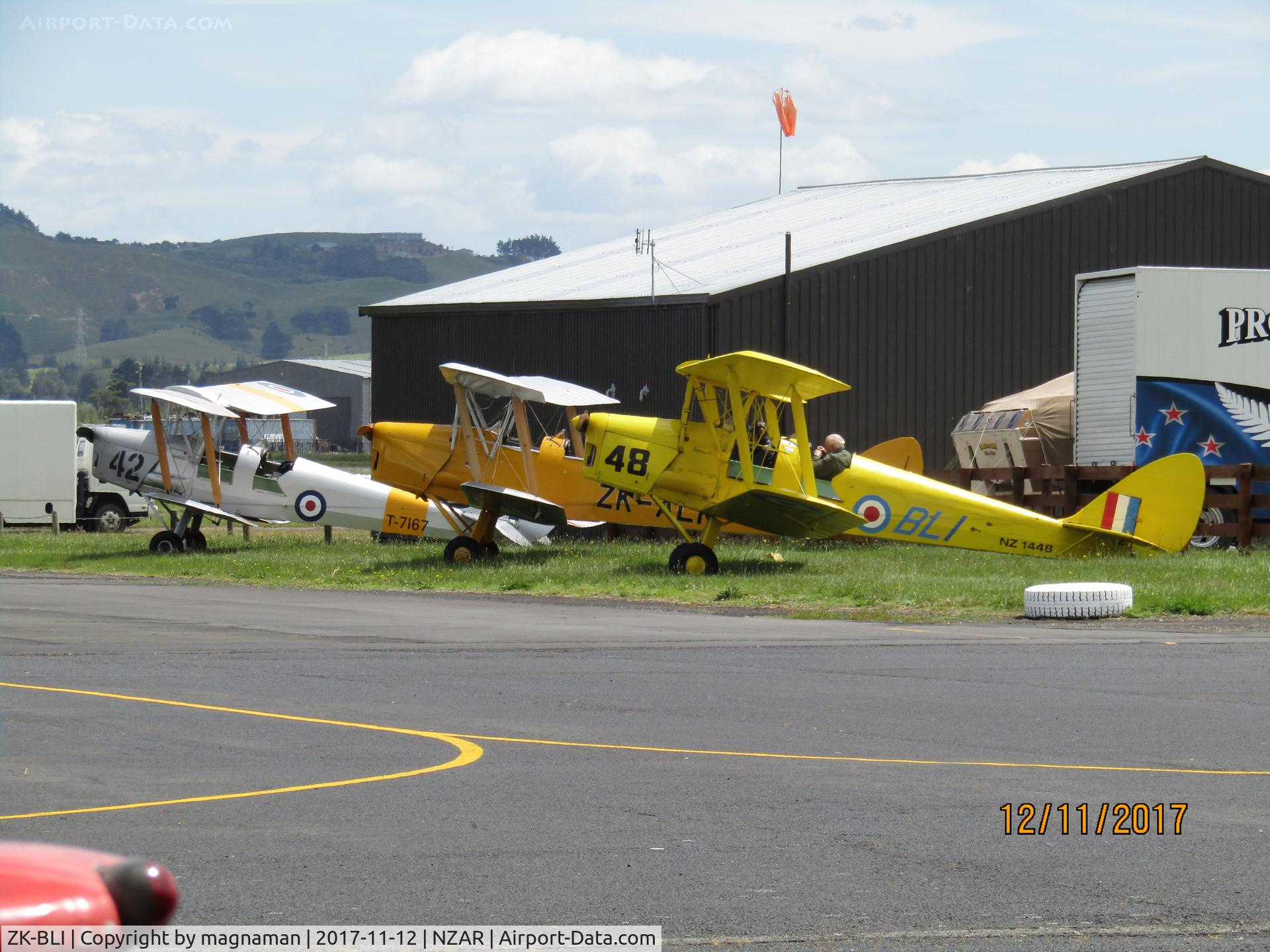 ZK-BLI, De Havilland New Zealand DH-82A Tiger Moth C/N DHNZ128, with two fellow moths awaiting flying slot