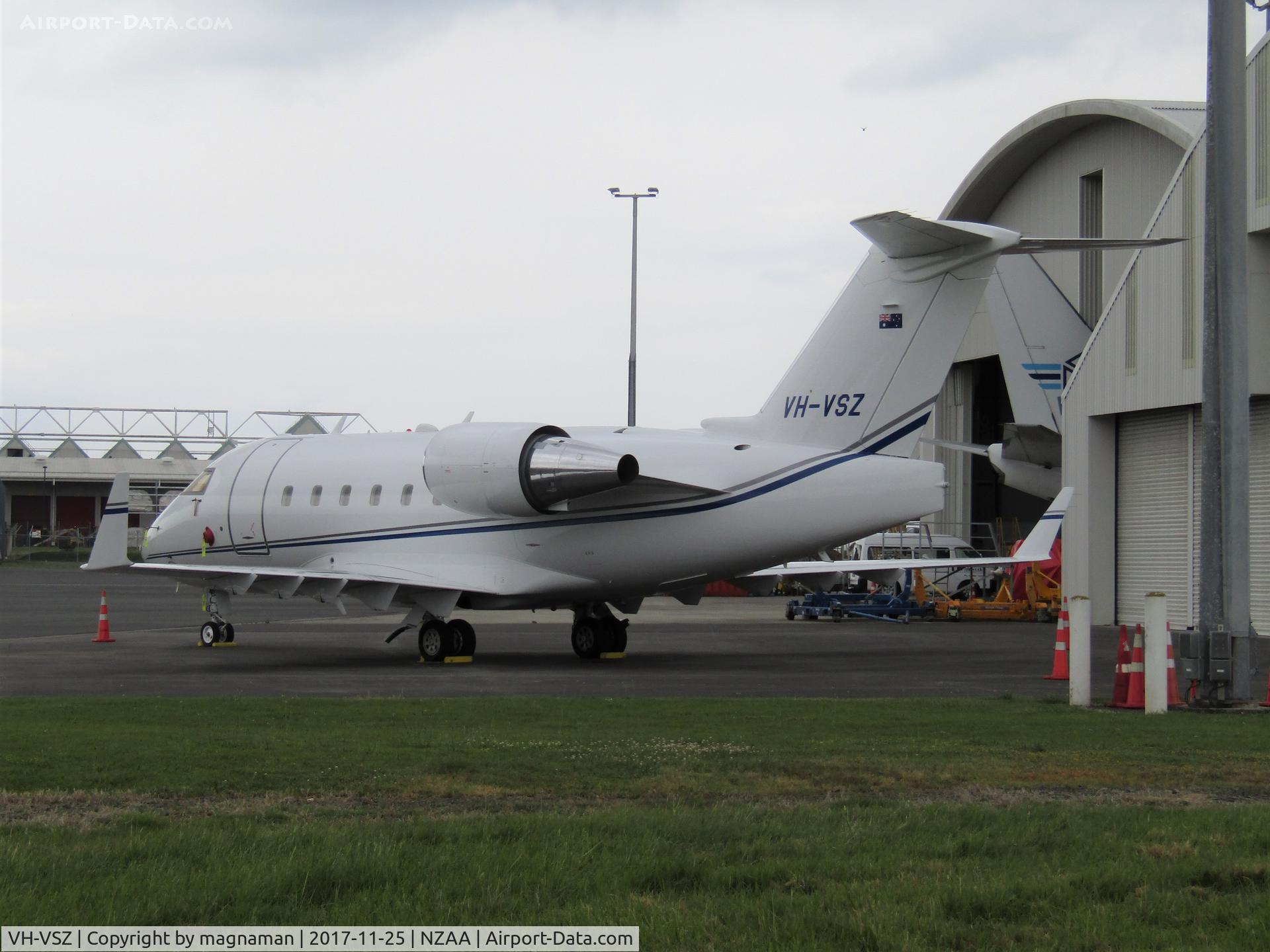 VH-VSZ, 1999 Bombardier Challenger 604 (CL-600-2B16) C/N 5411, on stand at AKL