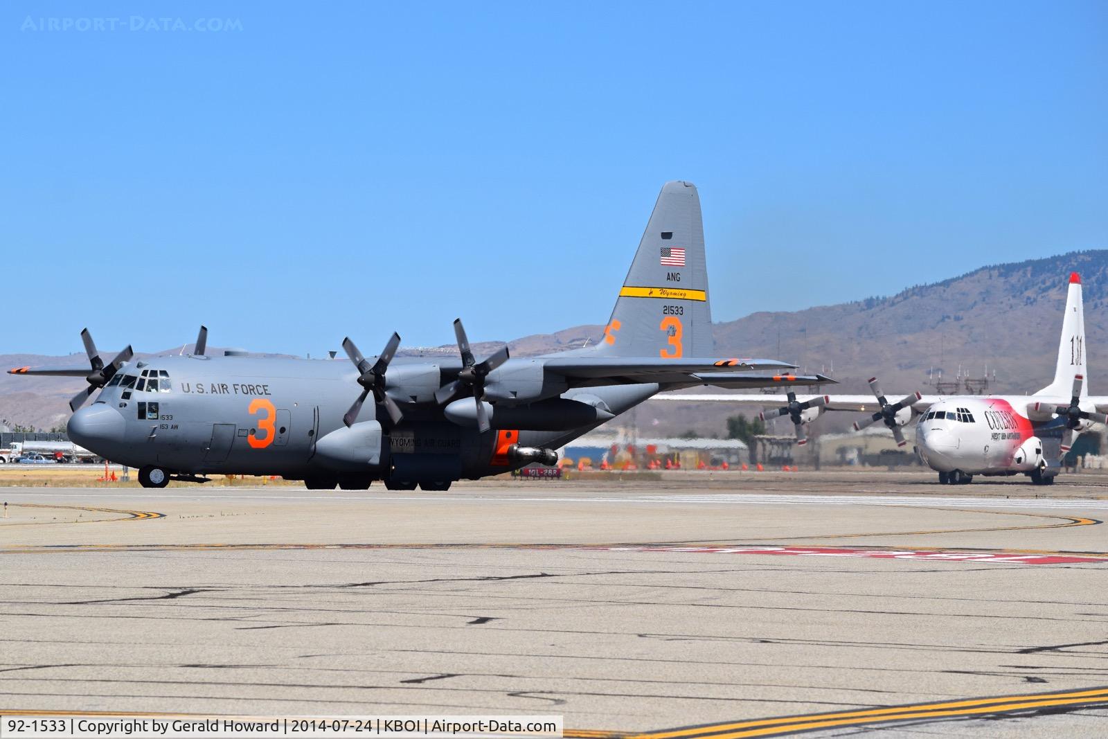92-1533, 1992 Lockheed C-130H Hercules C/N 382-5322, Taxiing on Mike followed by Tanker 131 (N130FF).  153rd Airlift Wing, WY ANG.