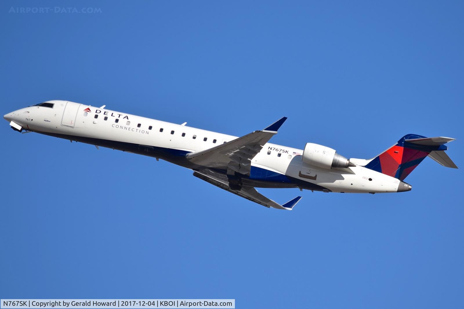N767SK, 2005 Bombardier CRJ-702 (CL-600-2C10) Regional Jet C/N 10233, Departing RWY 28R.
