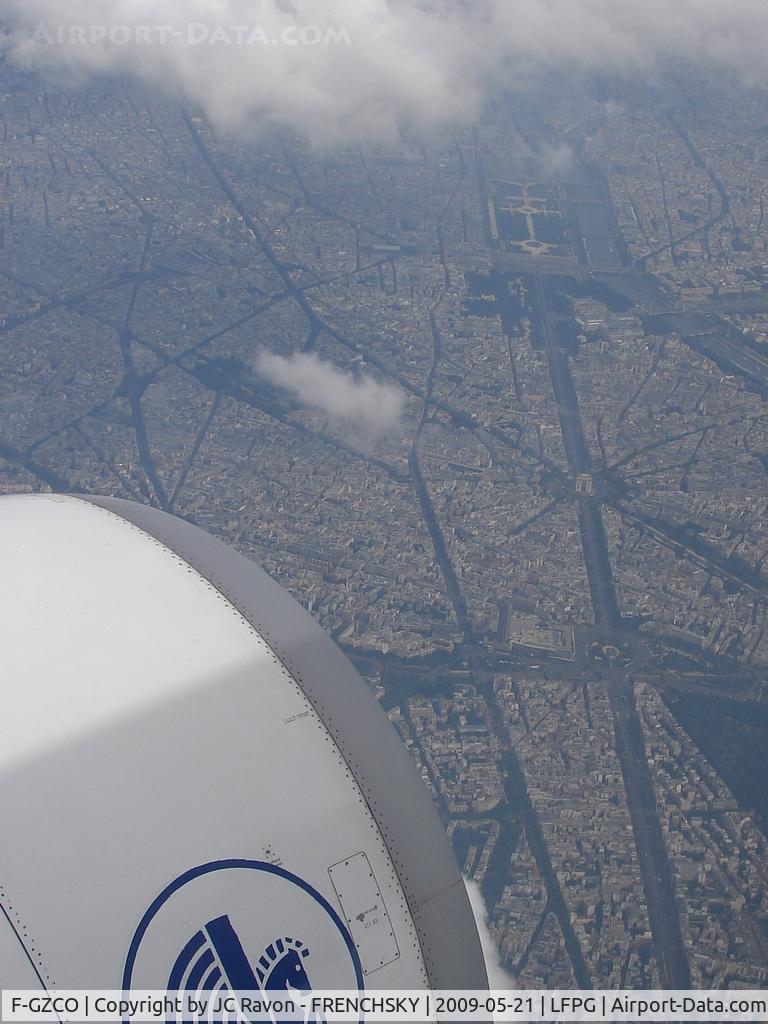 F-GZCO, 2006 Airbus A330-203 C/N 657, overflying Paris Champs Elysées and Arc de Triomphe after take off destination Le Cairo airport