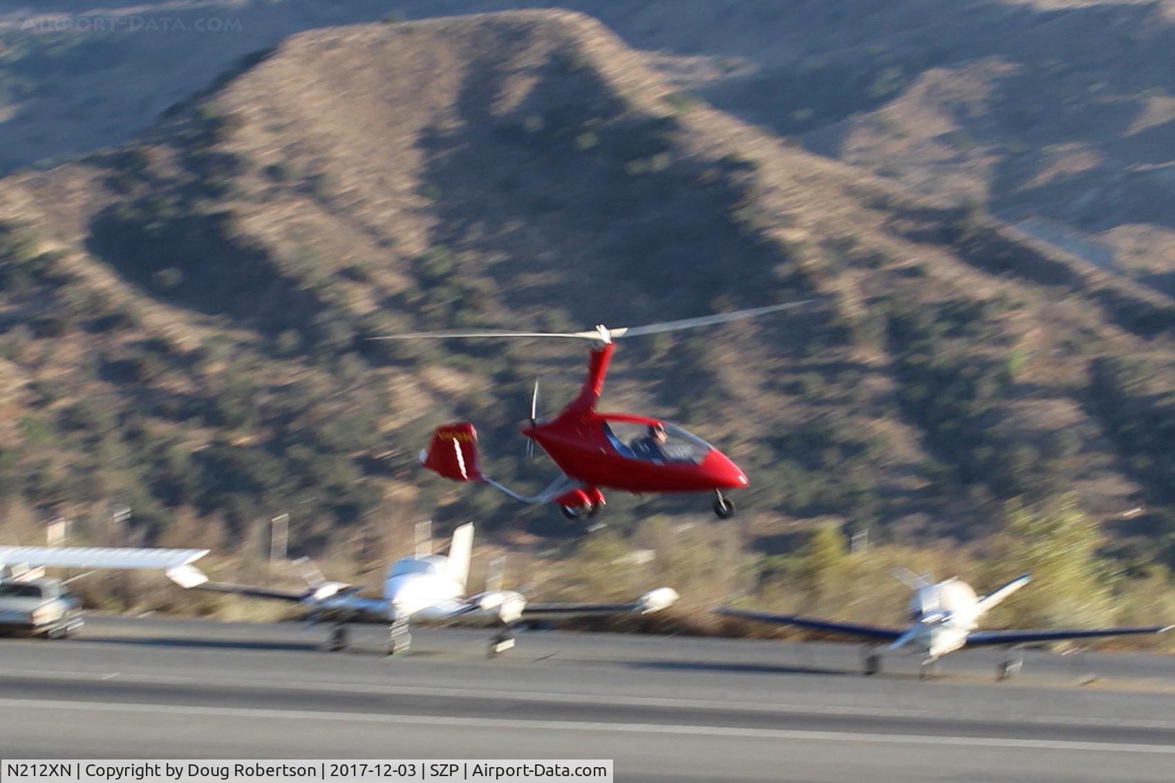 N212XN, 2015 AutoGyro Calidus C/N C00368, 2015 Pollock Autogyro Gmbh CALIDUS, Rotax Turbocharged 914ULS 115 Hp pusher, 2 tandem seats, from Germany, takeoff climb Rwy 22