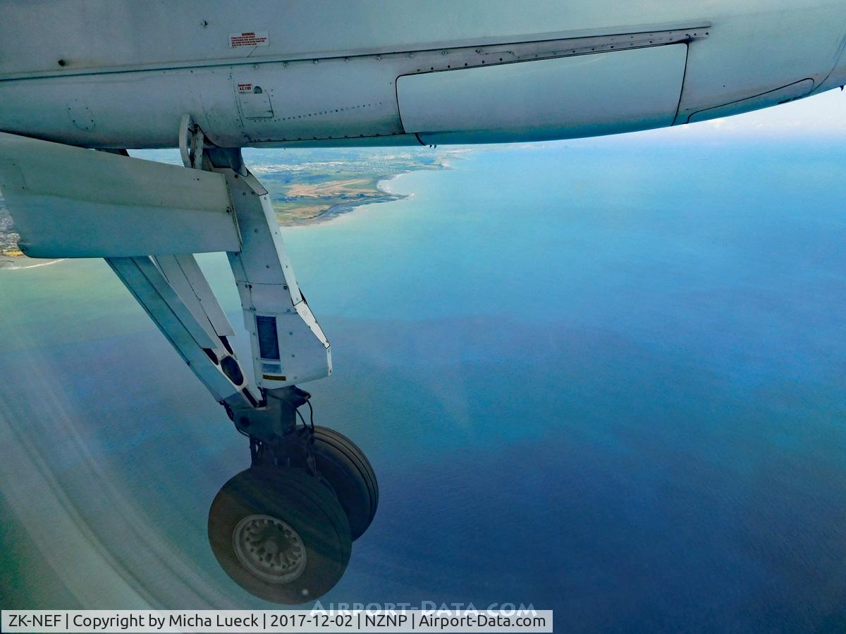ZK-NEF, 2005 De Havilland Canada DHC-8-311 Dash 8 C/N 620, Descending into New Plymouth. The airfield can be seen right under the main landing gear pod.